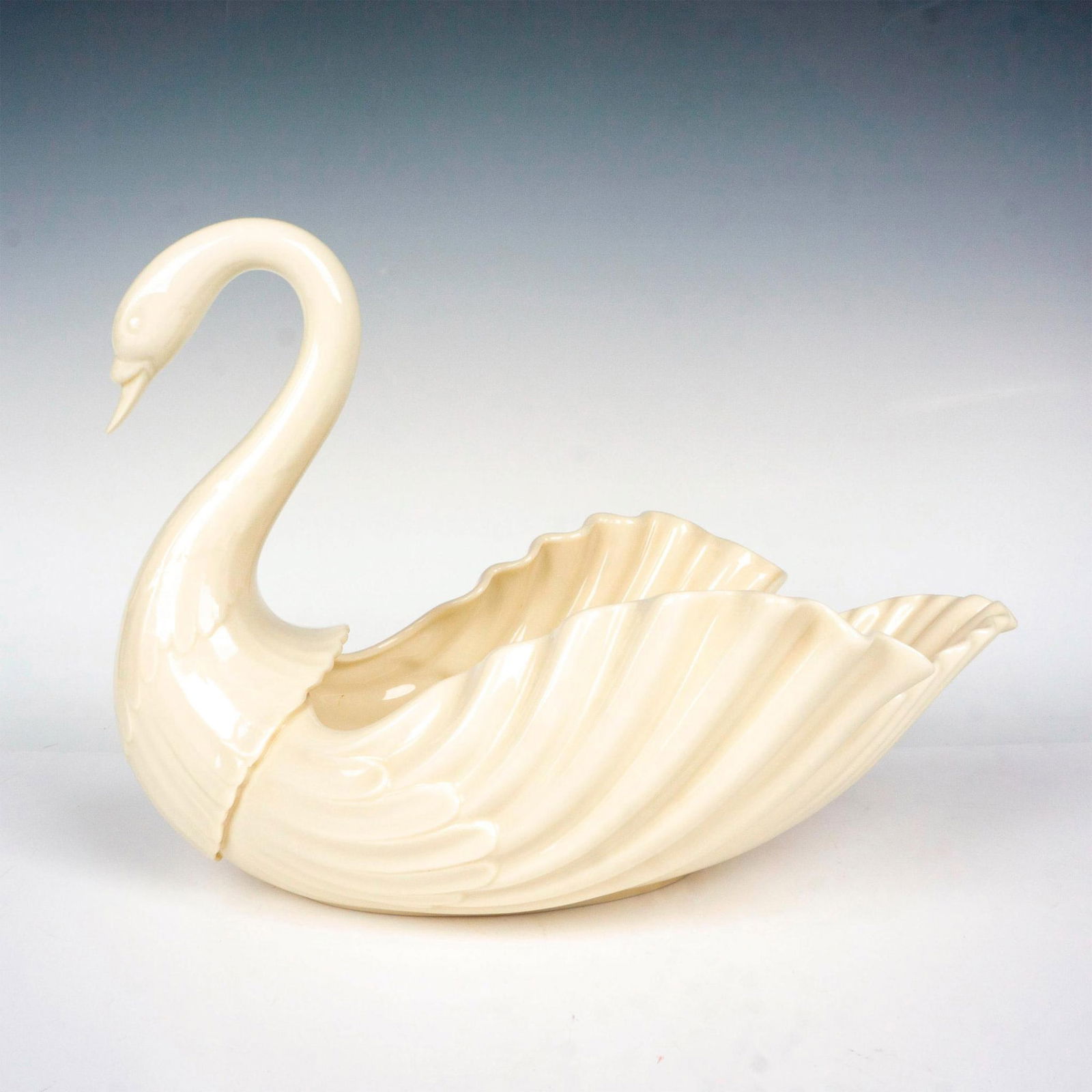 Vintage Lenox Porcelain Swan Centerpiece: A large bowl centerpiece shaped as an elegant swan. Lenox backstamp. Issued: 20th century Dimensions: 11.75"L x 8.5"W x 8.5"H Manufacturer: Lenox Country of Origin: United States