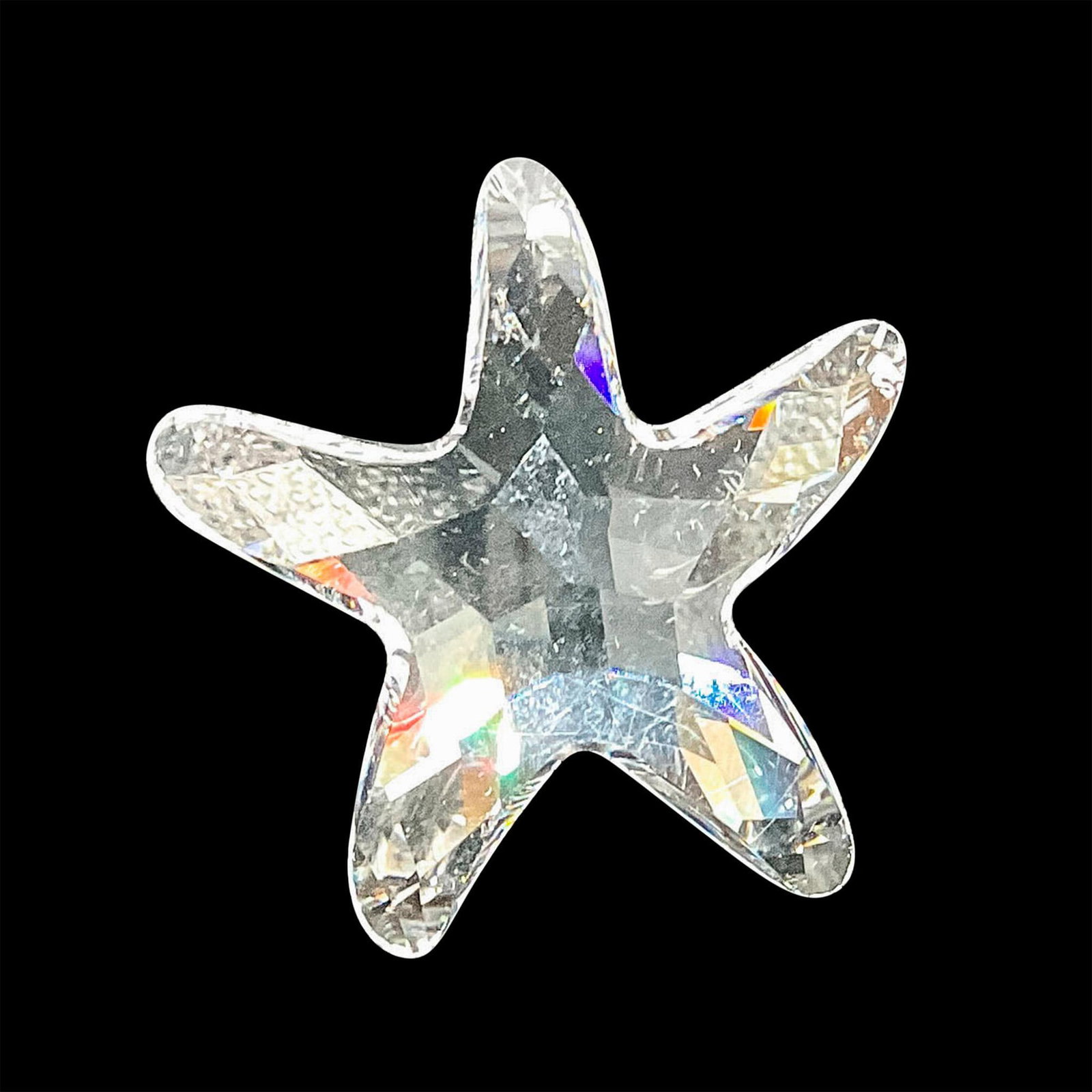 Swarovski Crystal Figurine, SCS Starfish: This well-crafted clear crystal faceted figurine sparkles with brilliance and showcases the beauty of a starfish is a fun and whimsical way. It was given as a joining or renewal gift for members of th