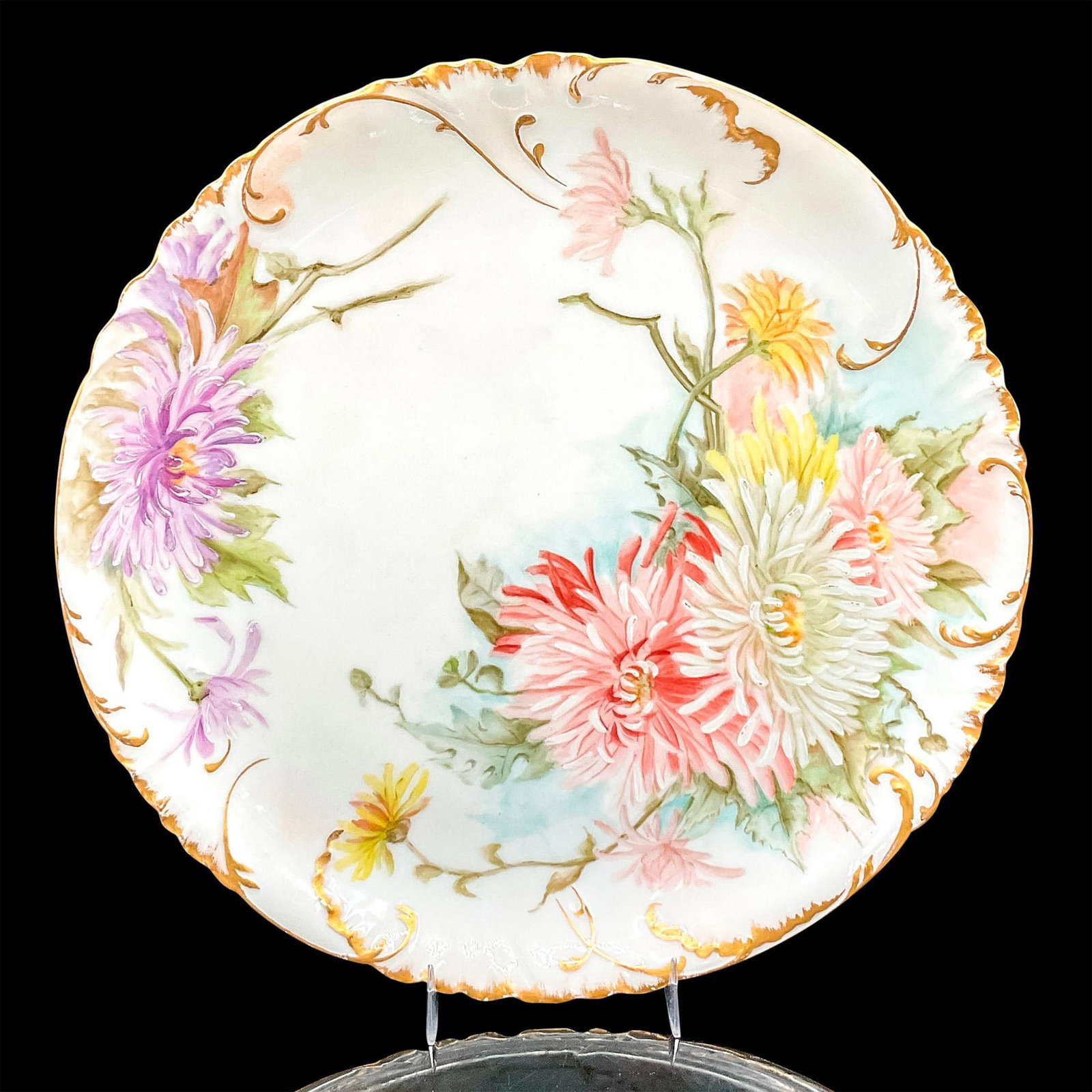Antique Haviland & Co Limoges Plate, Chrysanthemums: Charming hand painted porcelain plate decorated with pink, white, yellow and purple flowers, gold rim and accents. H&C France backstamp. Issued: 1888-1896 Dimensions: 1.25"H x 12"dia Manufacturer: Hav