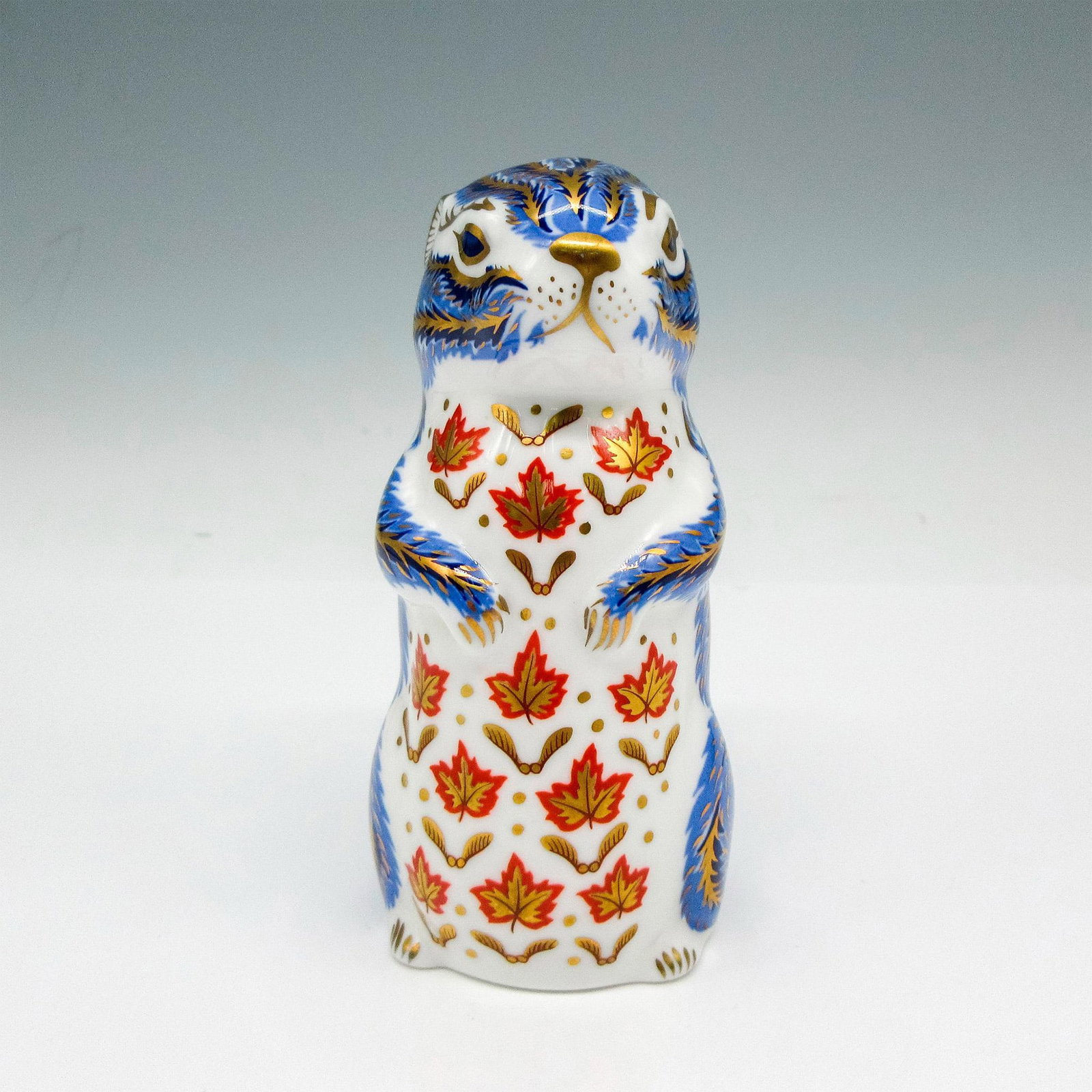 Royal Crown Derby Bone China Paperweight, Chipmunk: Part of the Imari Paperweight Collection. Adorable figural with blue, rust and gilding coloration throughout. Royal Crown Derby backstamp. Issued: 20th century Dimensions: 2"L x 2"W x 4.5"H Manufactur