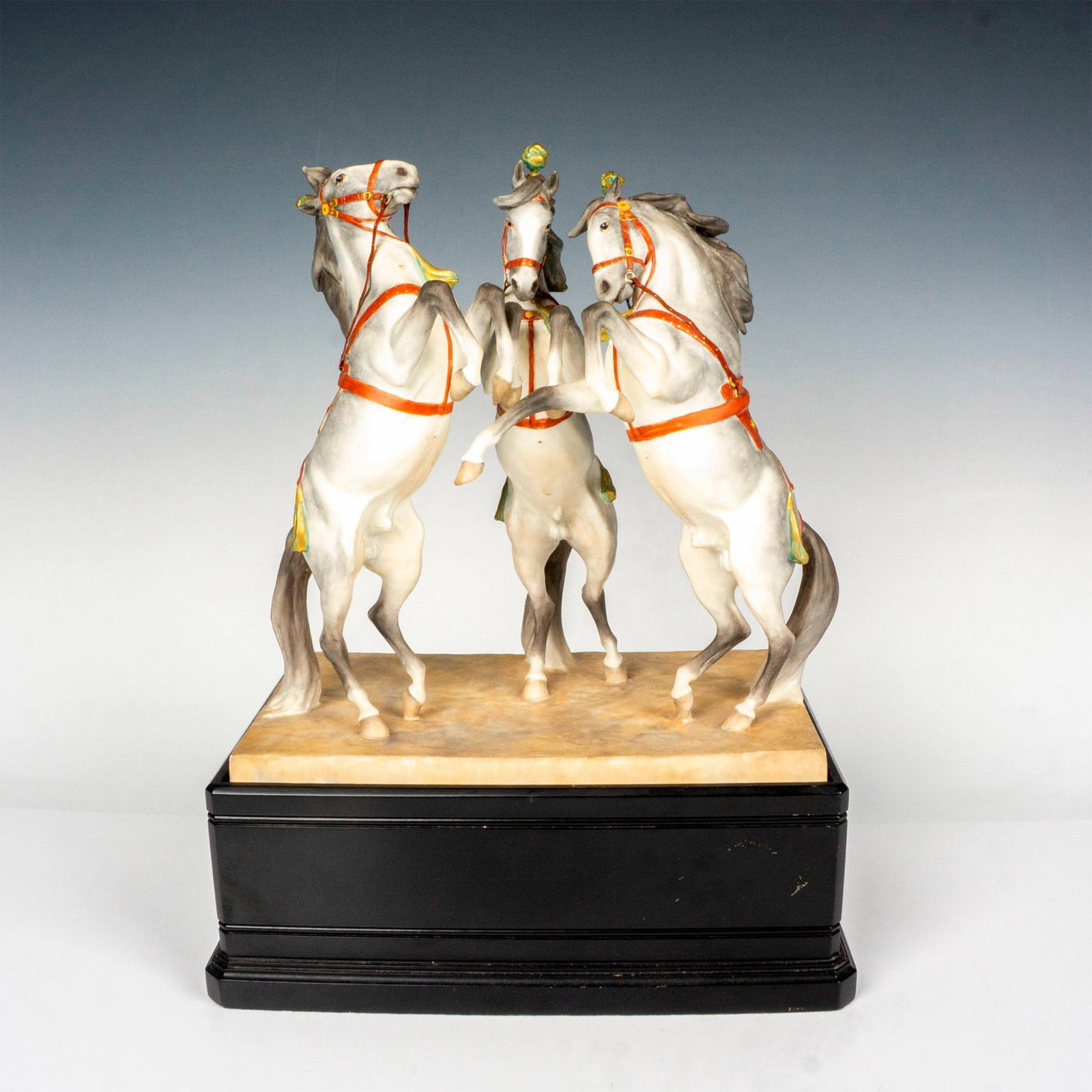 Royal Worcester Bone China Figurine, Circus Horse: 3179; naturalistic hand painted equestrian group figure of three gray horses. Royal Worcester backstamp. This item has a base included. Artist: Doris Linder Issued: 20th century Dimensions: 11.25"L x 