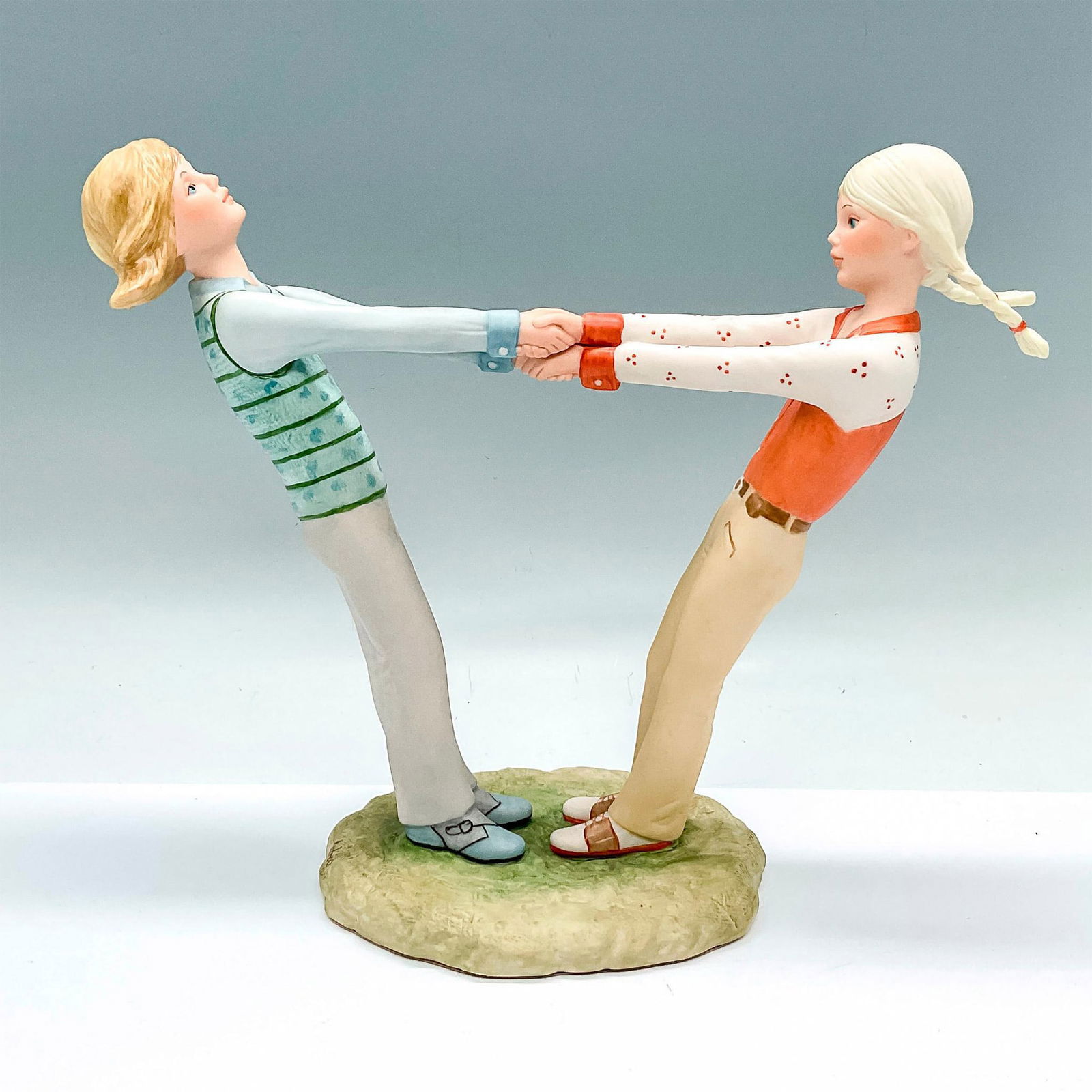 Cybis Porcelain Group Figurine, Lisa and Lynette: Hand painted figure of two girls holding hands and playing. Cybis markings on the side. Issued: c. 1978-1980 Dimensions: 11"L x 4.5"W x 9.25"H Manufacturer: Cybis Country of Origin: United States