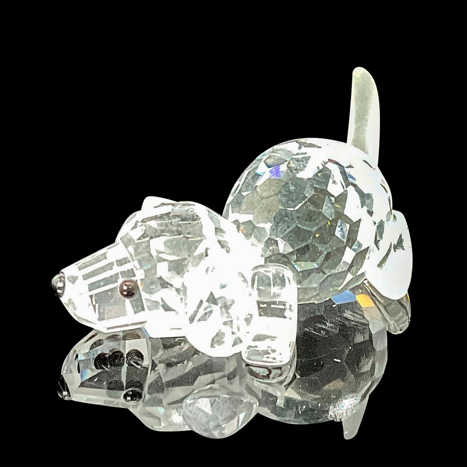 Swarovski Crystal Figurine, Beagle Puppy Playing: Introduced as part of The Peaceful Countryside theme group, this adorable little puppy figurine captures a moment of playfulness, appearing ready to retrieve a ball or stick. Its body is crafted from 