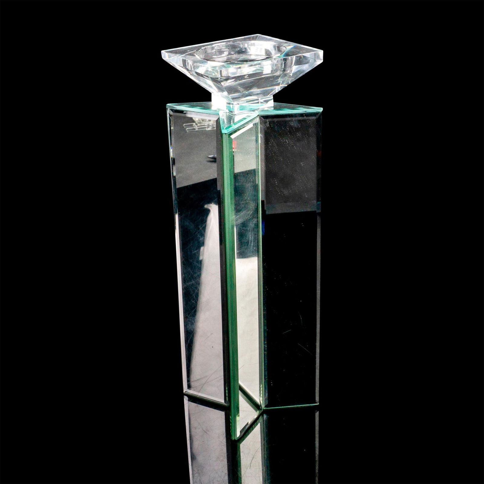 Z Gallerie Four Point Star Mirrored Candle Holder: A candle holder that is in the shape of a star with four points along with eight mirrored sides and a Lucite top. Z Gallerie manufacturing sticker. Dimensions: 4"L x 4"W x 14"H Manufacturer: Z Galleri