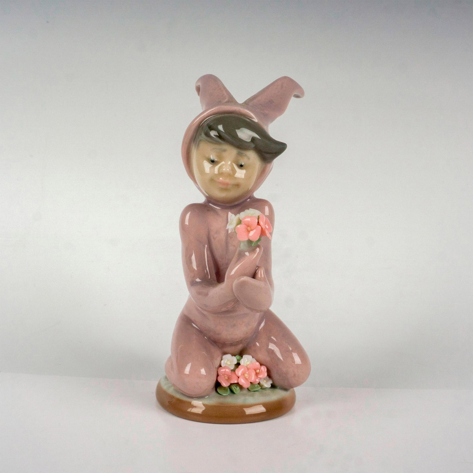 Boy And His Bunny 1001507 - Lladro Porcelain Figurine: Glossy finish; Lladro backstamp. Artist: Juan Huerta Issued: 1986 - 1991 Dimensions: 4.75"H Manufacturer: Lladro Country of Origin: Spain Condition Age related wear.