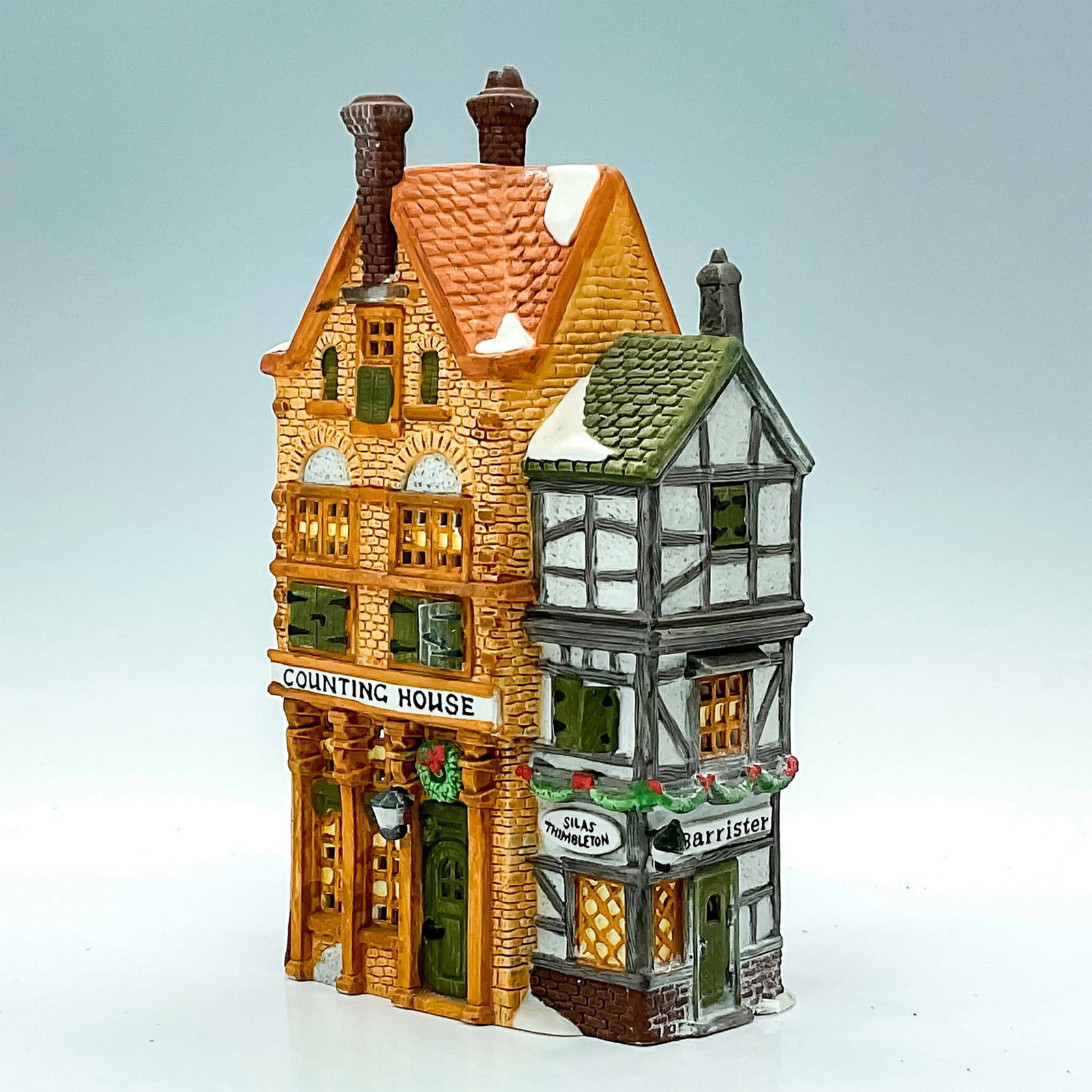 Department 56 Figure, Counting House: Part of the Dickens’ Village Series. Porcelain, depicting tall Tudor style business office of Silas Thimbleton Barrister with light feature. This item has its original box with dimensions: 8 in.