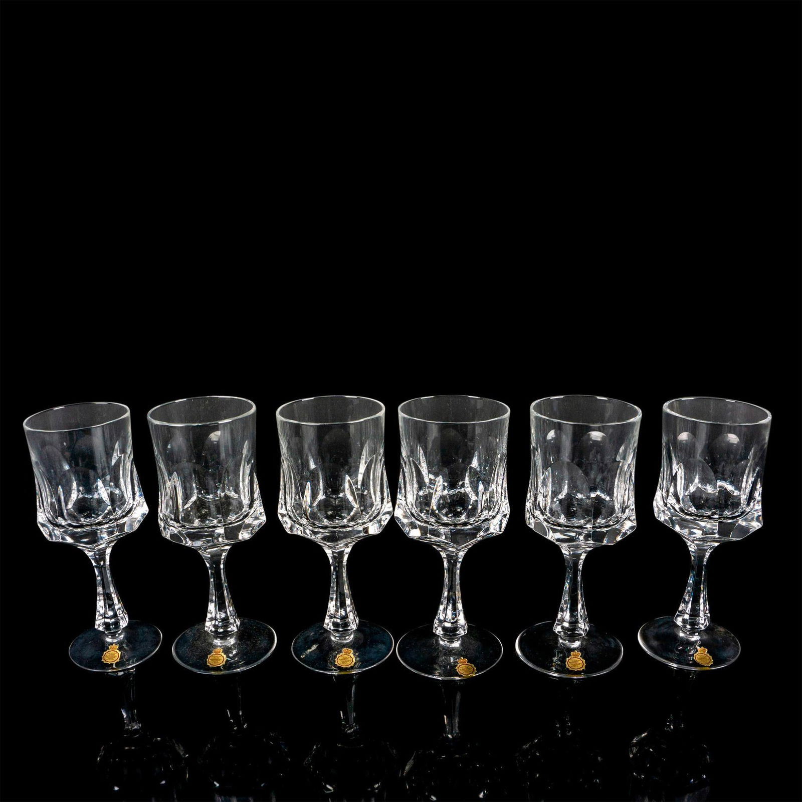 6pc Bleikristall Water Goblets, Andrea Pattern: 6 elegant wine glasses, each featuring a six-sided stem and large carved-out facets surrounding the base of a hexagonally shaped bowl, adding a touch of sophistication to your tableware. This item has