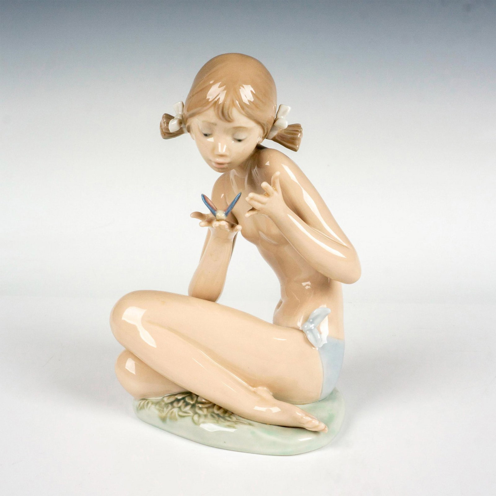 Free As A Butterfly 1001483 - Lladro Porcelain Figurine: Glossy finish; Lladro backstamp. Artist: Salvador Debon Issued: 1985 - 1987 Dimensions: 7"H Manufacturer: Lladro Country of Origin: Spain