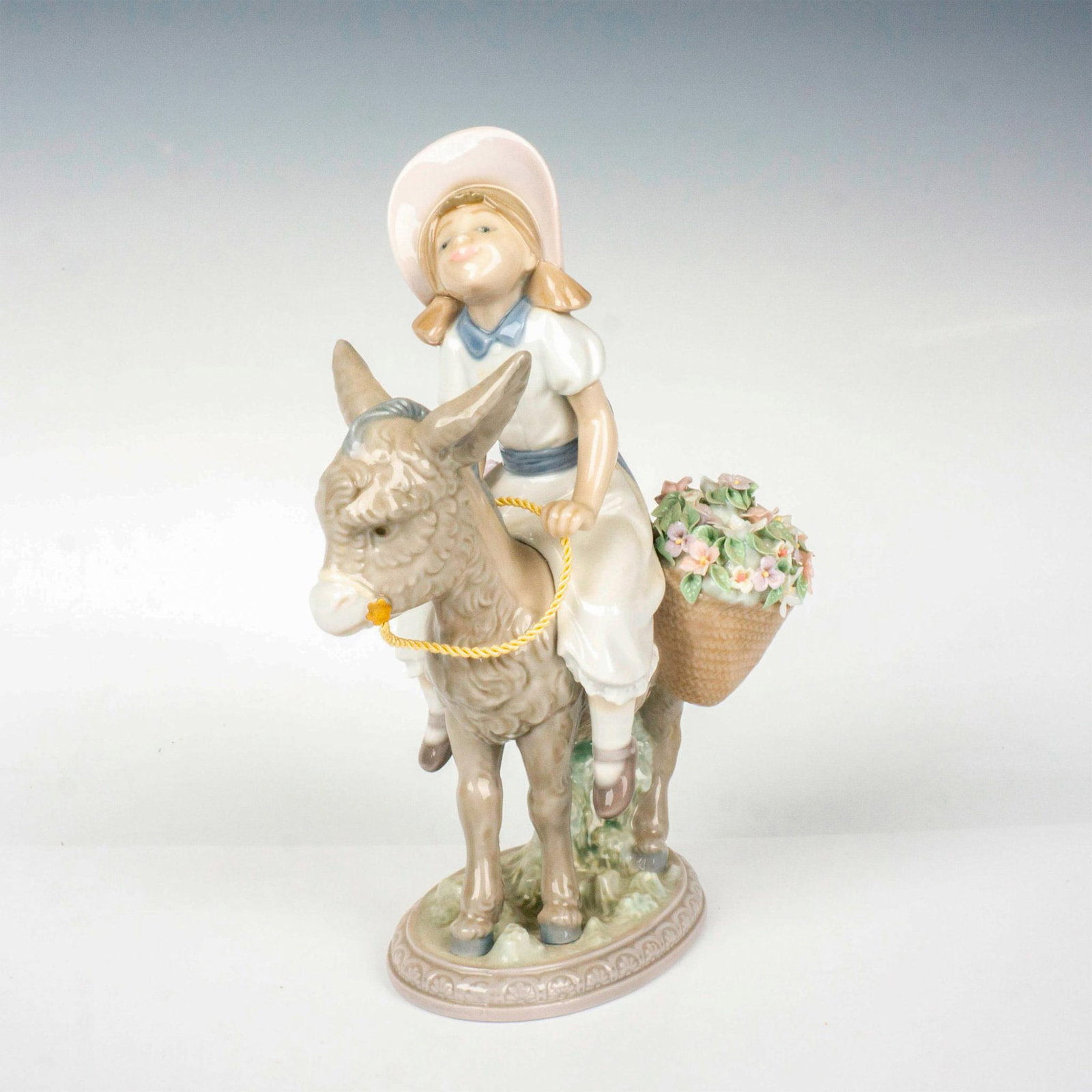 Look At Me! 1005465 - Lladro Porcelain Figurine: Glossy finish; Lladro backstamp. Includes original box. Box measures: 9.25"L x 6.25" x 10"H. Artist: Jose Puche Issued: 1988 - 2004 Dimensions: 7.75"H x 5.5"W Manufacturer: Lladro Country of Origin:</