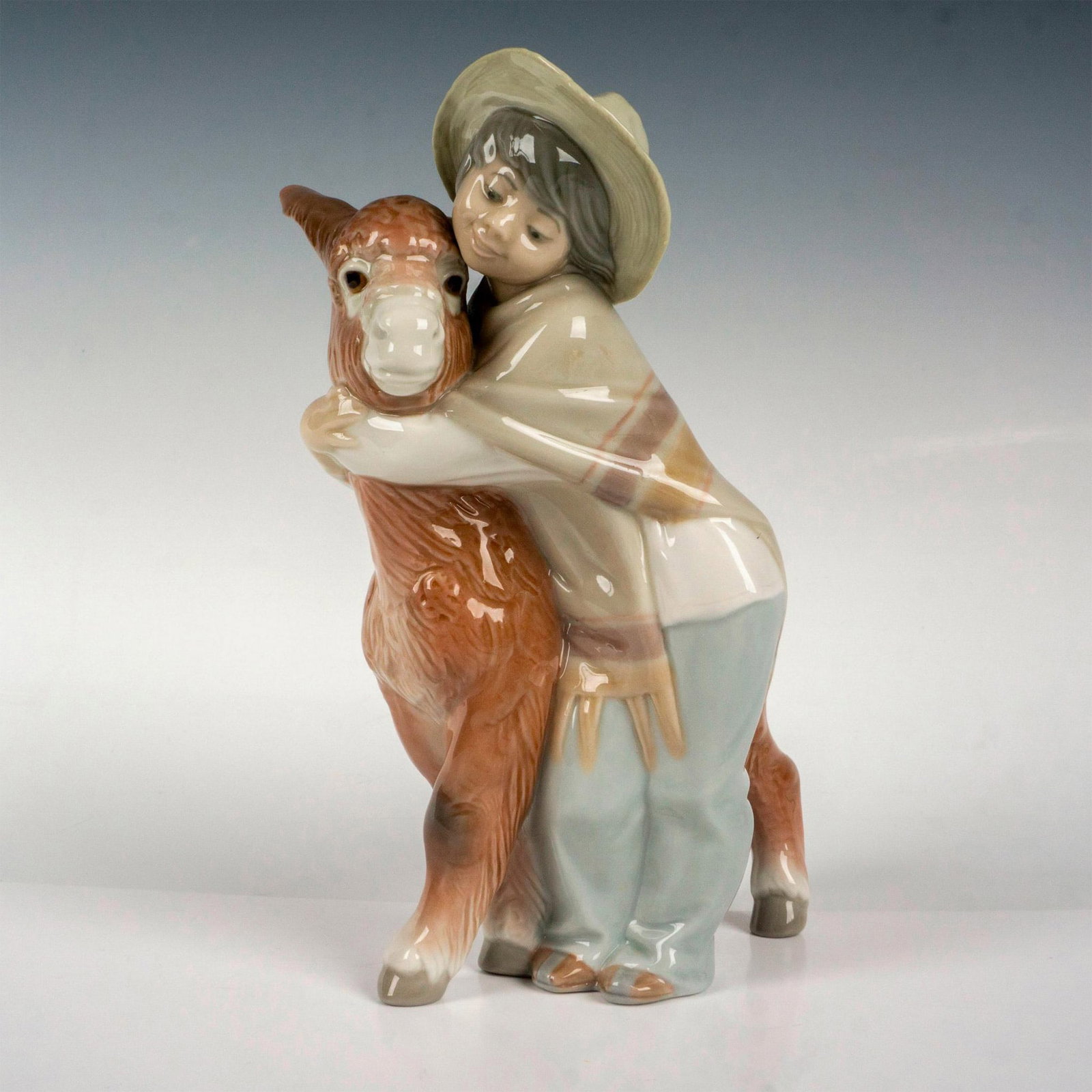 Platero And Marcelino 1001181 - Lladro Porcelain Figurine: Glossy finish; Lladro backstamp. Artist: Juan Huerta Issued: 1971 - 1981 Dimensions: 7.75"H Manufacturer: Lladro Country of Origin: Spain