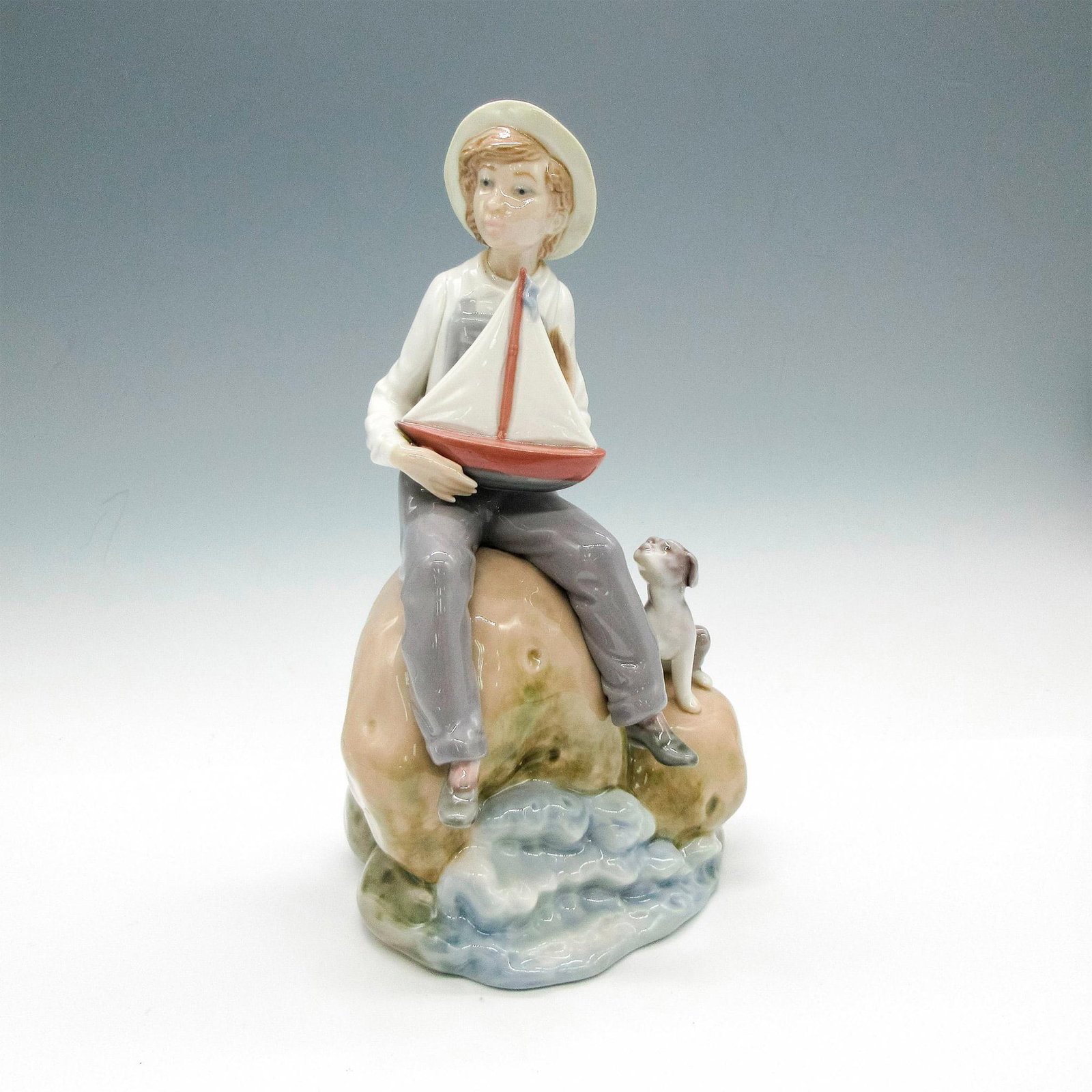 Sea Fever 1005166 - Lladro Porcelain Figurine: Glossy finish; Lladro backstamp. Artist: Vicente Martinez Issued: 1983 - 1991 Dimensions: 9"H Manufacturer: Lladro Country of Origin: Spain