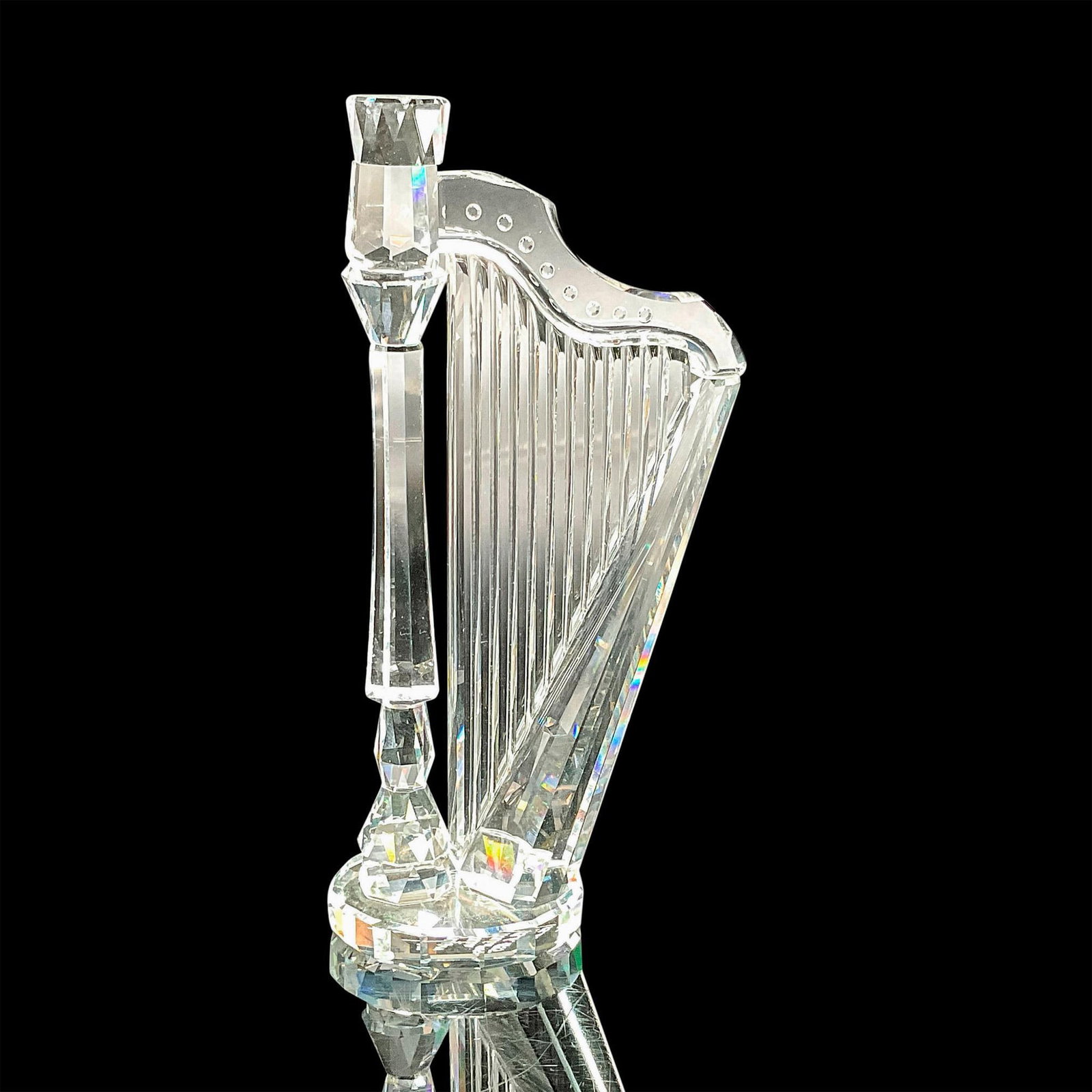 Swarovski Crystal Figurine, Harp Artist Signed: This Swarovski crystal harp is signed by the artist June 6, 1995. It was part of the Crystal Melodies collection and is made from clear crystal. Swarovski etched backstamp. Artist: Martin Zendron Issu