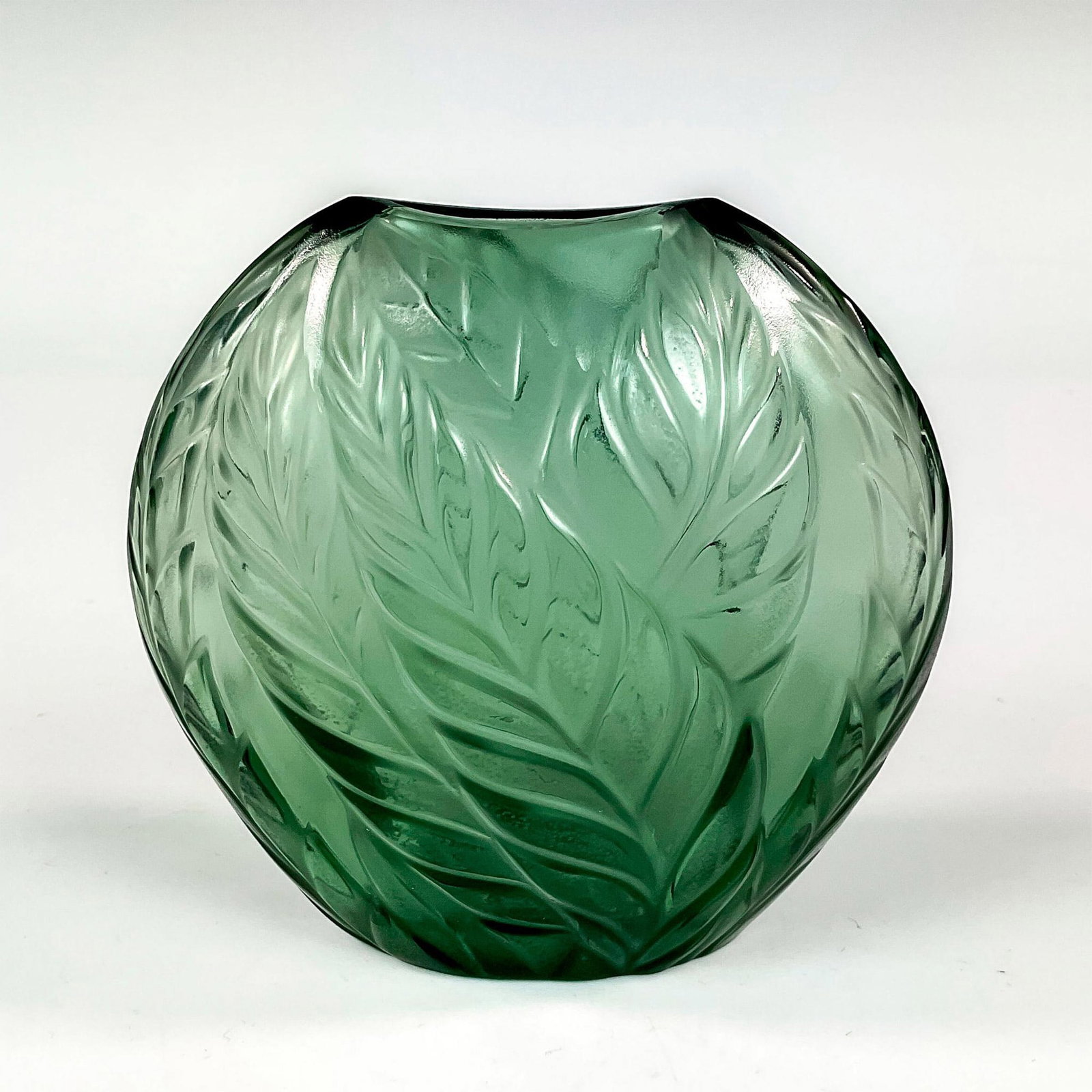 Lalique Crystal Vase, Filicaria: A gris colored frosted and clear vessel of pillow form, decorated with filicaria leaves. Marked Lalique France to underside. Dimensions: 4.5"W x 4.5"H Country of Origin: France Manufacturer: Lalique P