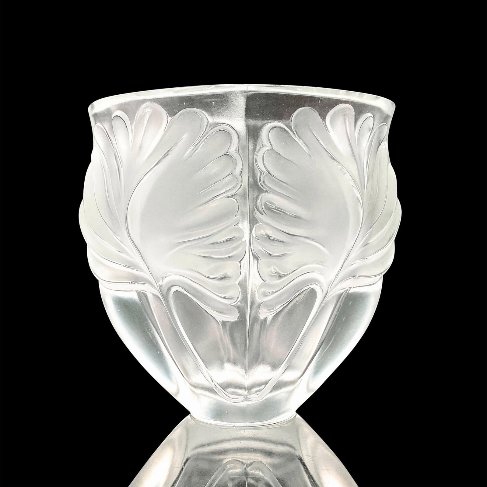 Lalique Crystal Vase, Noailles: Impressive, frosted crystal vase with dramatic leave depicted in raised relief throughout. Dimensions: 8"L x 6.5"W X 8"H Country of Origin: France Manufacturer: Lalique Provenance: Collection of Marie