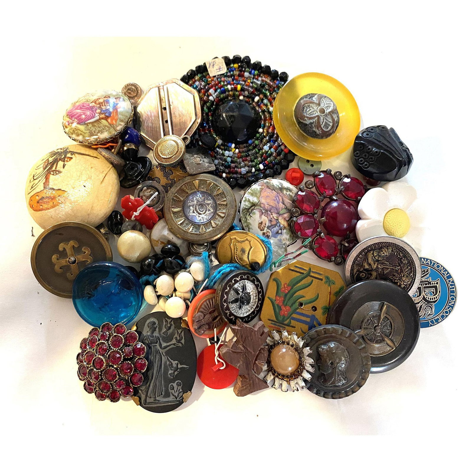 A Nice Bag Lot of Assorted Materials: A bag full of goodies and buttons. This bag is not a big bag but it is a bag full of good things for the collector and the creator. There is Bakelite, ceramics including basalt, jeweled, celluloid , p