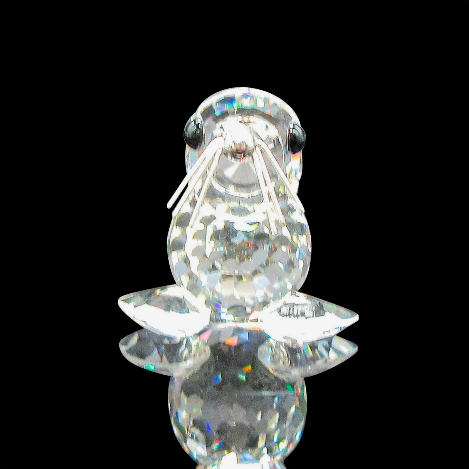 Swarovski Silver Crystal Figurine, Seal Baby: Clear crystal body with black eyes, metal whiskers and nose. Part of the Silver Crystal Collection. Swarovski etched backstamp. 7663046000. This item has its original box: 2.5"H x 3.25"dia. Issued: 20