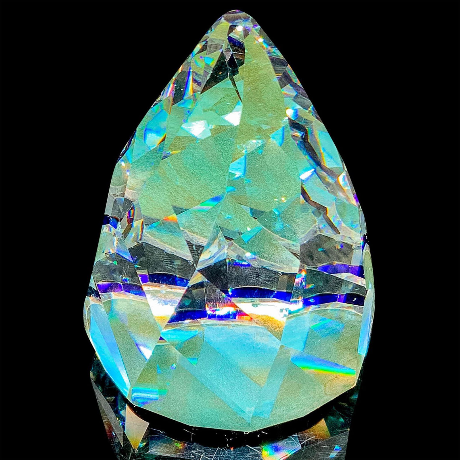 Swarovski Crystal Cone Rio Paperweight: This retired Swarovski crystal cone/rio paperweight has a black flocked base. It is believed that this shape of paperweight was developed to resemble Sugar Loaf Mountain in Rio de Janeiro. Dimensions: