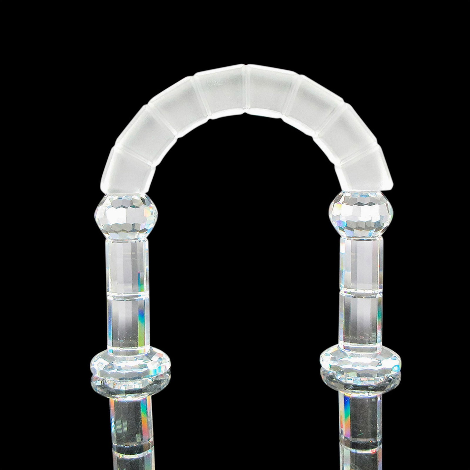 Swarovski Crystal Figurine, Nativity Arch: Clear columned, footed crystal base with frosted segment arch. Swarovski backstamp. Issued: c. 1991 Dimensions: 3.5"L x 1"W x 4"H Manufacturer: Swarovski Country of Origin: Austria