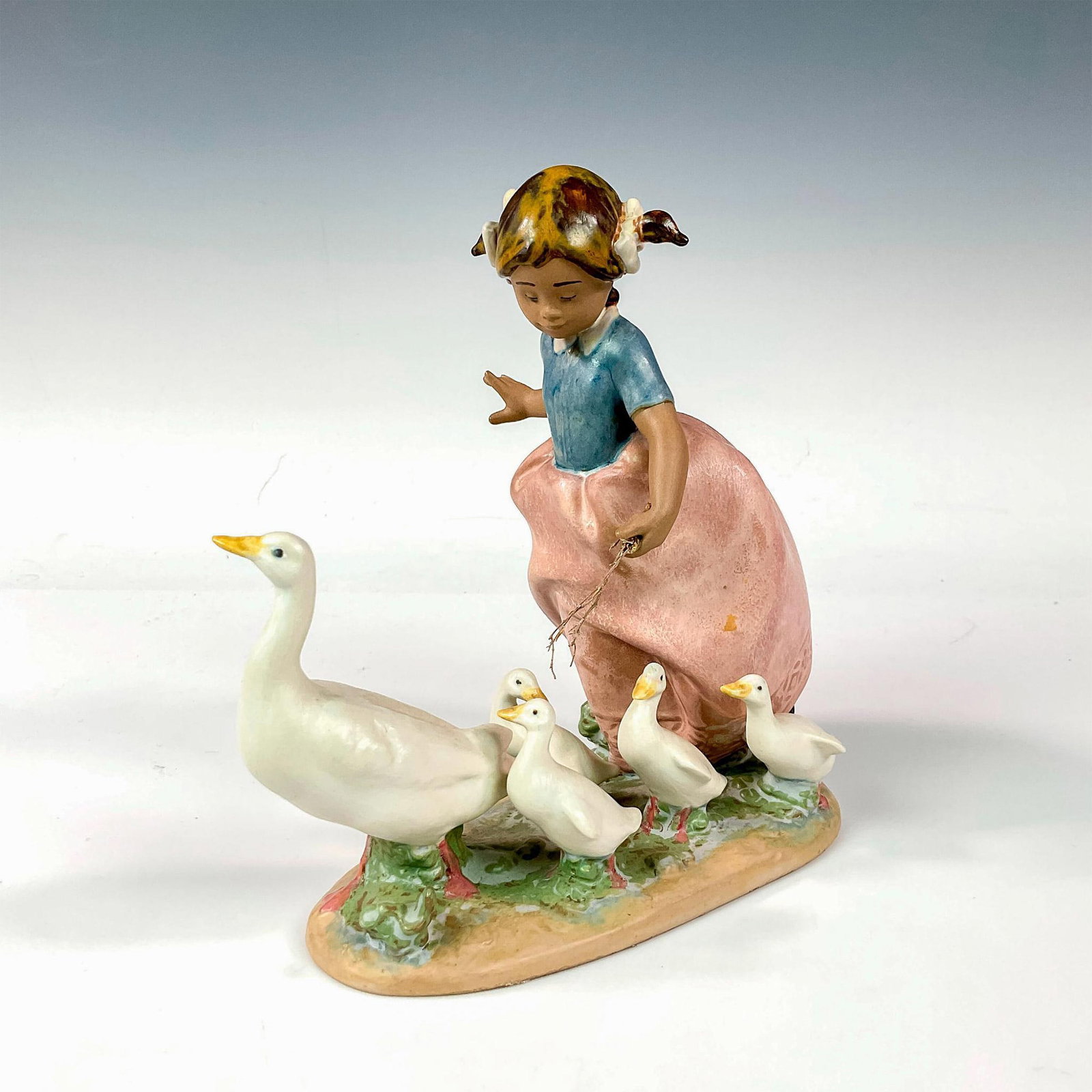 Hurry Now 1012306 - Lladro Porcelain Figurine: Gres finish; Lladro backstamp. Artist: Antonio Ramos Issued: 1995 - 2000 Dimensions: 7.5"H Manufacturer: Lladro Country of Origin: Spain