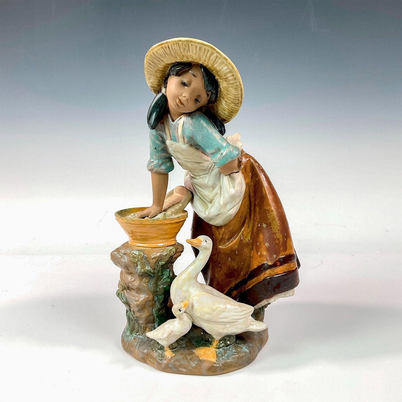 Laundry Day 1012216 - Lladro Porcelain Figurine: Gres finish; Lladro backstamp. Artist: Francisco Polope Issued: 1991 - 2004 Dimensions: 8.75"H Manufacturer: Lladro Country of Origin: Spain