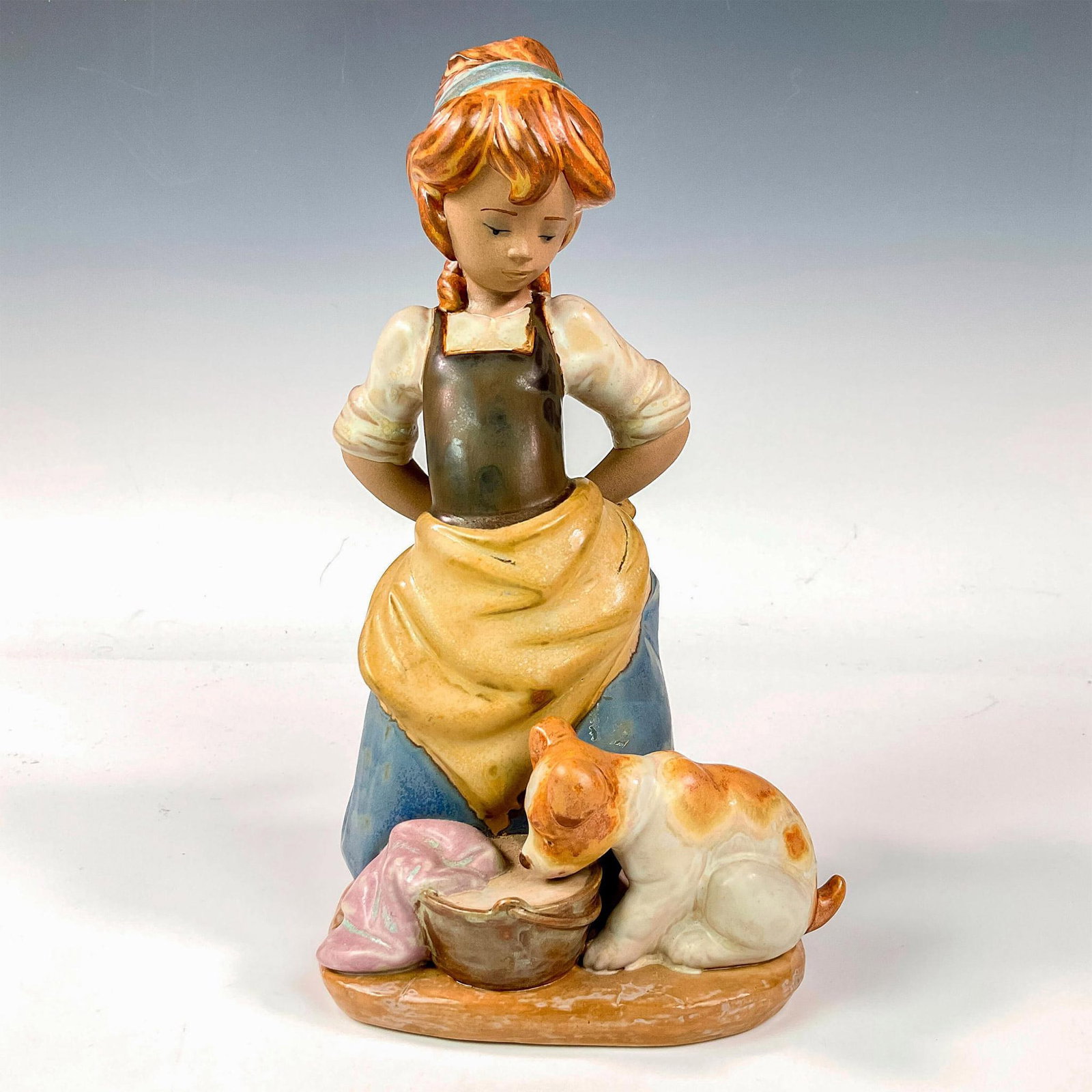 Nosy Puppy 1012096 - Lladro Porcelain Figurine: Gres finish; Lladro backstamp. Artist: Juan Huerta Issued: 1978 - 1993 Dimensions: 9.75"H Manufacturer: Lladro Country of Origin: Spain