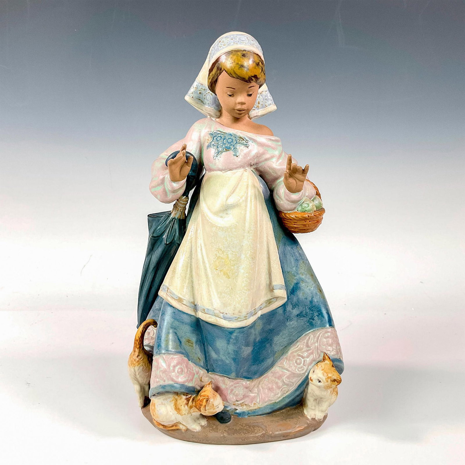 Underfoot 1012219 - Lladro Porcelain Figurine: Gres finish; Lladro backstamp. Artist: Juan Huerta Issued: 1992 - 2001 Dimensions: 11.5"H Manufacturer: Lladro Country of Origin: Spain