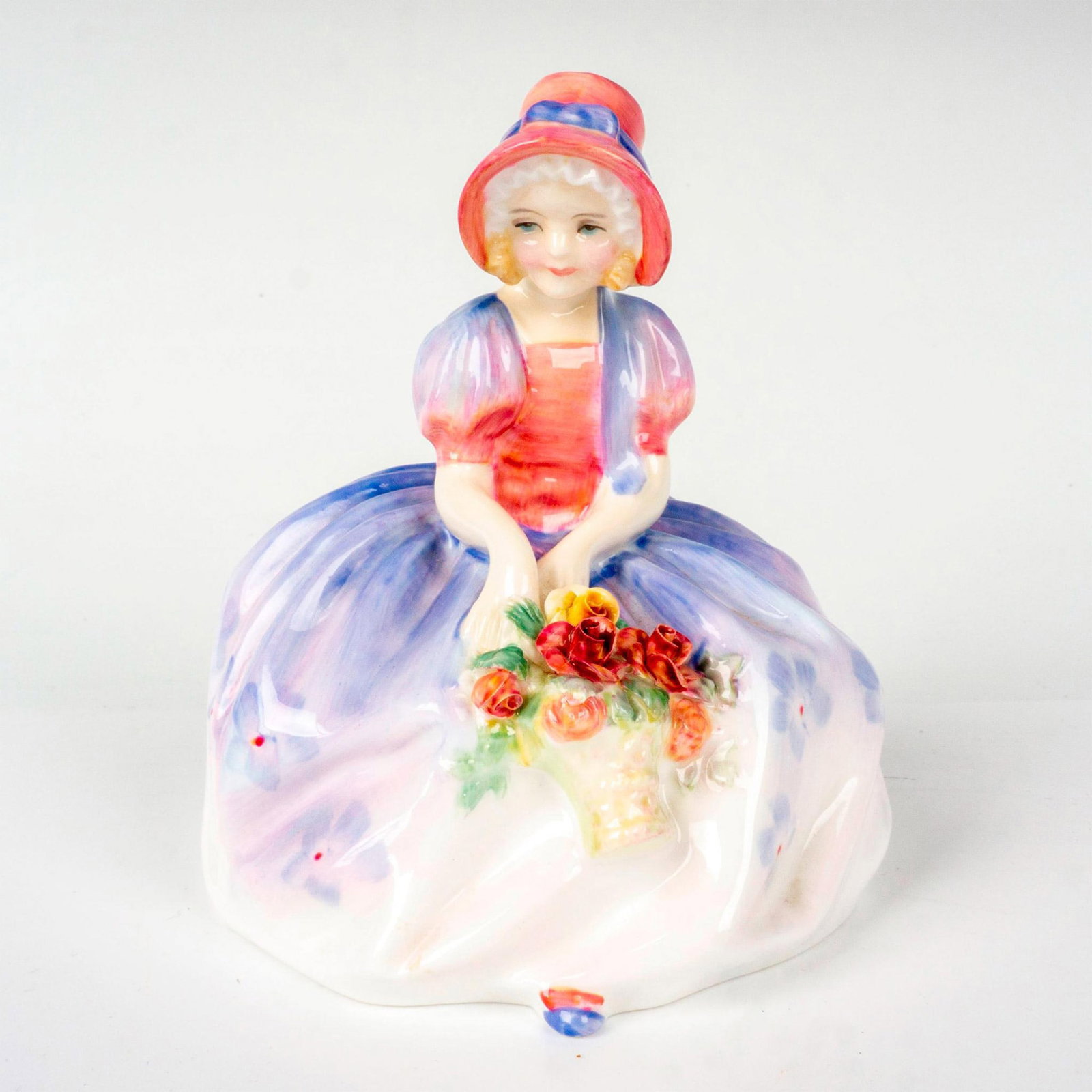 Monica - HN1467 - Royal Doulton Figurine: Harradine Classics series; young girl with flower bouquet in hands. Royal Doulton backstamp. Artist: Leslie Harradine Issued: 1931 - 1995 Dimensions: 4"H Manufacturer: Royal Doulton Country of Origin