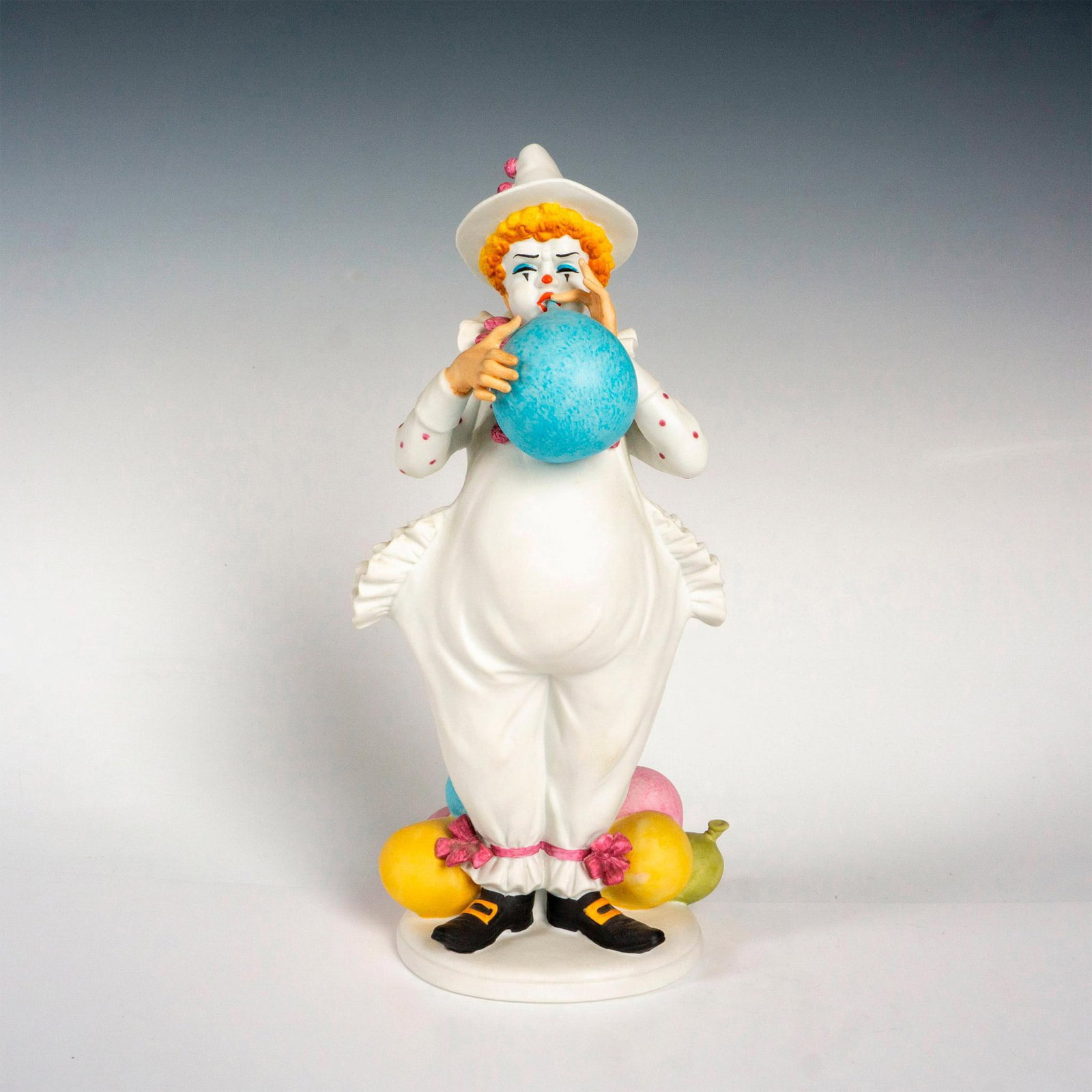 Breathtaking Performance - Royal Doulton Figurine: Limited edition bisque glaze. Carnival of Clowns series. Royal Doulton backstamp. Artist: Ben Black Issued: 1983 Dimensions: 5"L x 4"W x 10.25"H Edition Number: 1702 of 3500 Manufacturer: Royal Doul