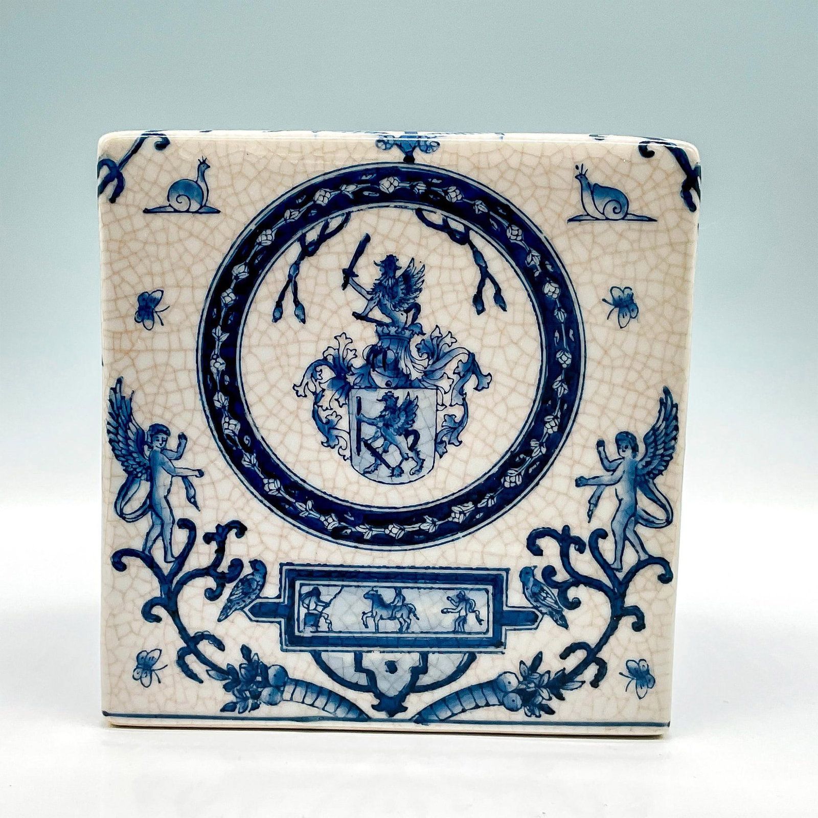 Vintage Porcelain Tissue Box: A blue and white hand painted tissue box with stylized sphinx s and egyptian style illustrations. Dimensions: 5.75"L x 5.75"W x 6"H