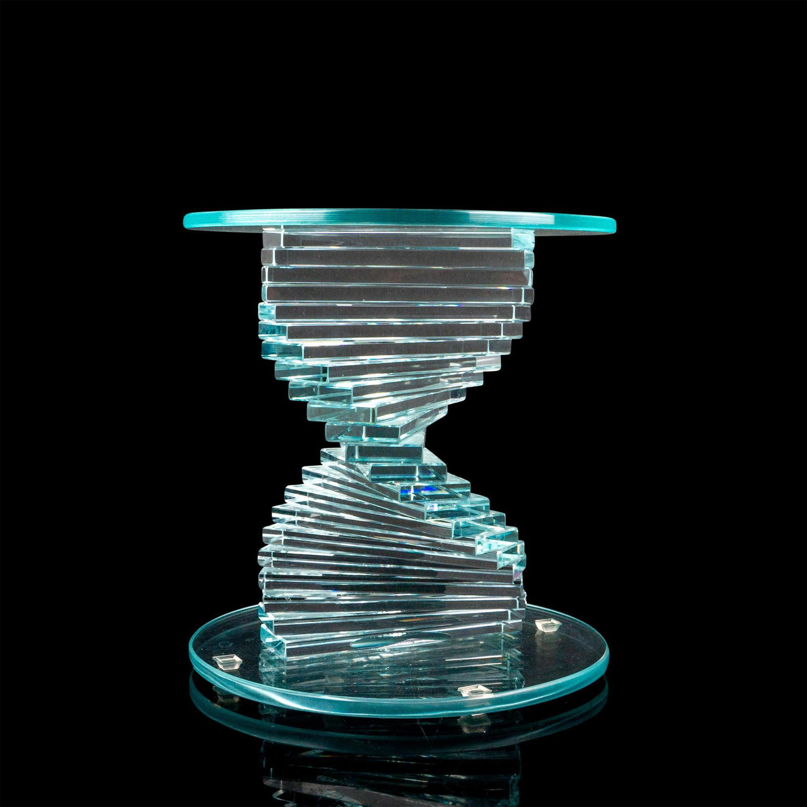 Helix Spiral Modern Glass Base: A clear stand for a vase or figurine with a spiral column between a disk-shaped top and bottom. Dimensions: 9.5"W x 10.25"H Provenance: Marie-Claude Lalique private collection.