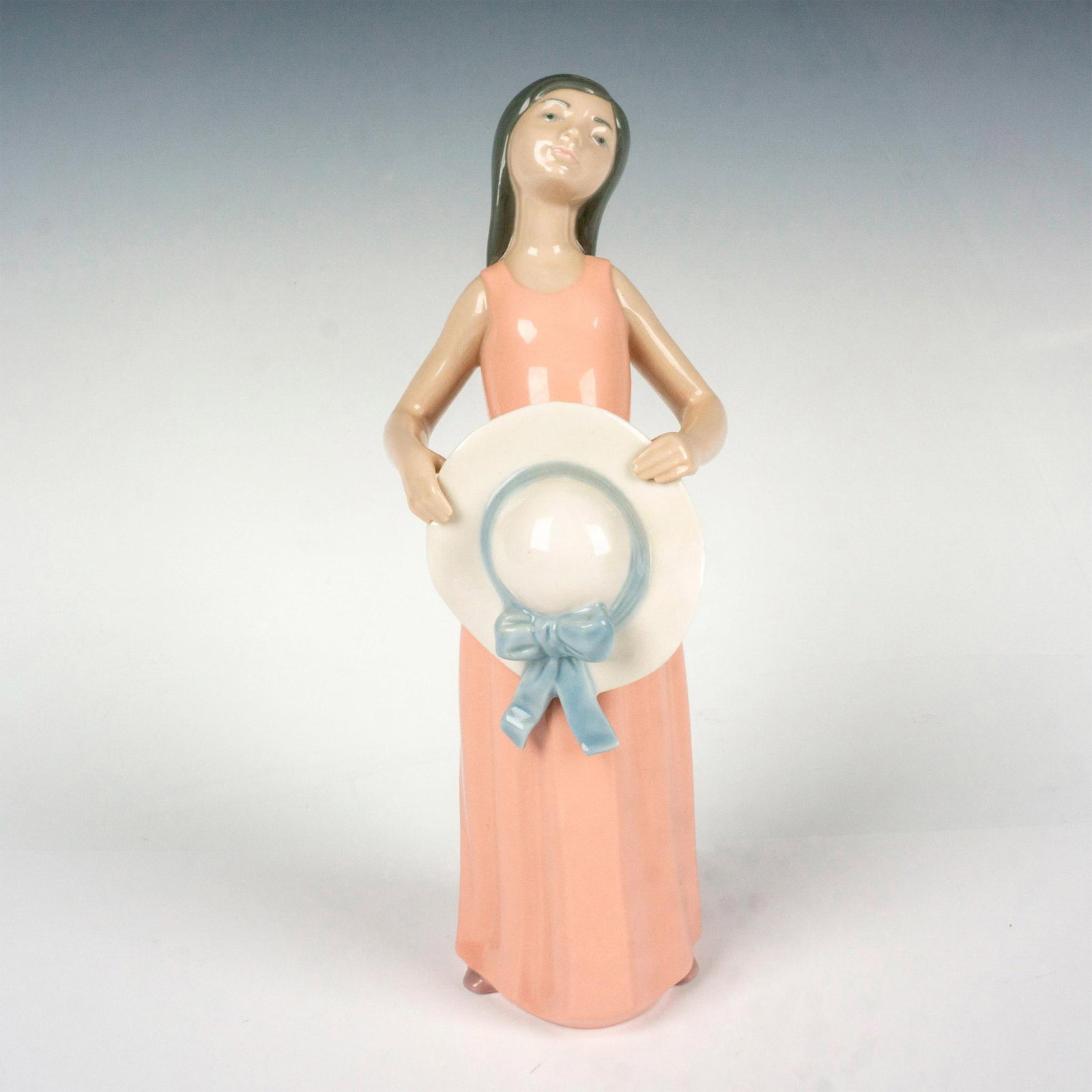 Dreamer 1005008 - Lladro Porcelain Figurine: Glossy finish; Lladro backstamp. Includes original box. Box measures 13.5"L x 5"W x 4.5"H. Artist: Francisco Catala Issued: 1978 - 1999 Dimensions: 9.75"H x 3.5"W Manufacturer: Lladro Country of Origi