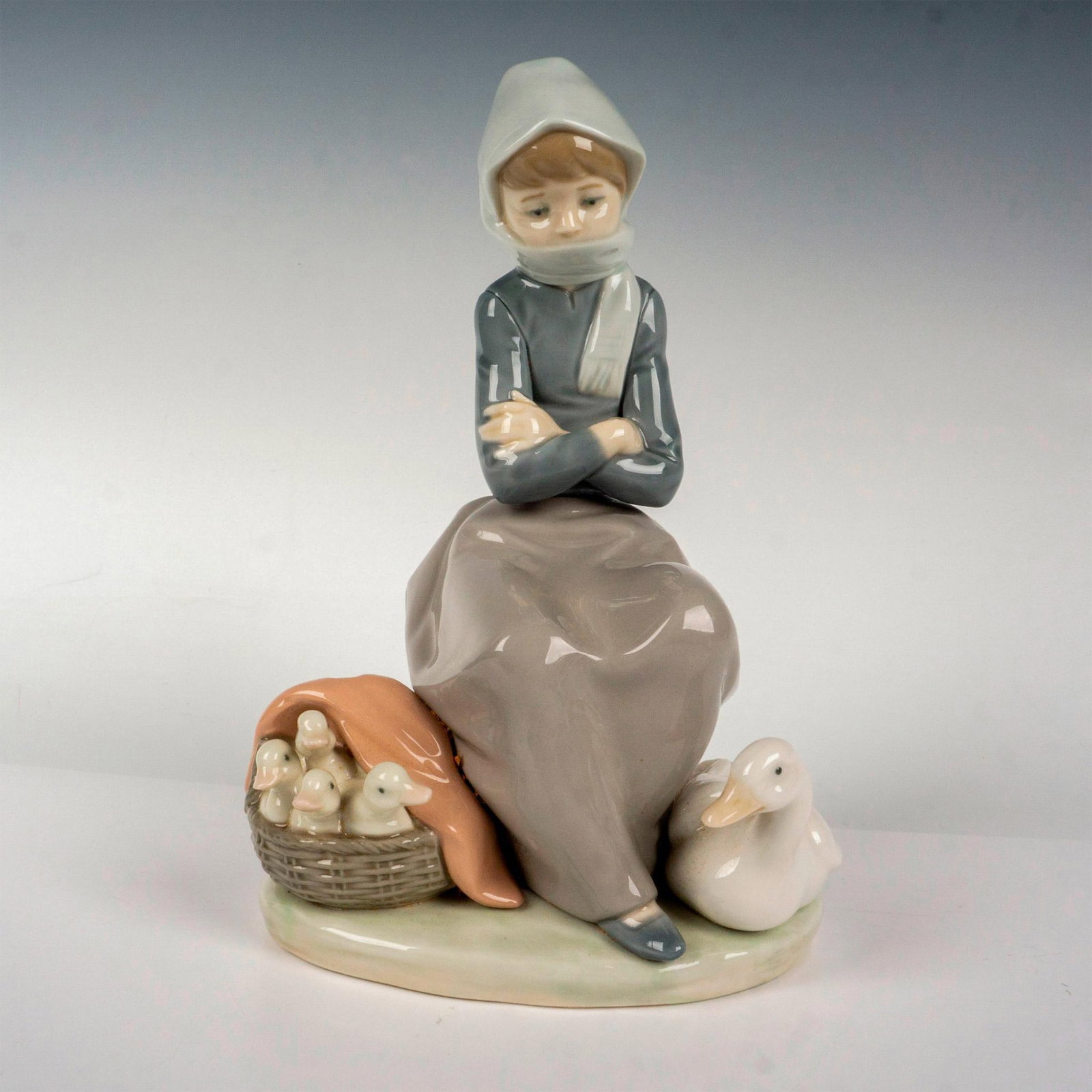 Girl With Ducks 1001267 - Lladro Porcelain Figurine: Glossy finish; Lladro backstamp. Artist: Juan Huerta Issued: 1974 - 1993 Dimensions: 7.75"H Manufacturer: Lladro Country of Origin: Spain