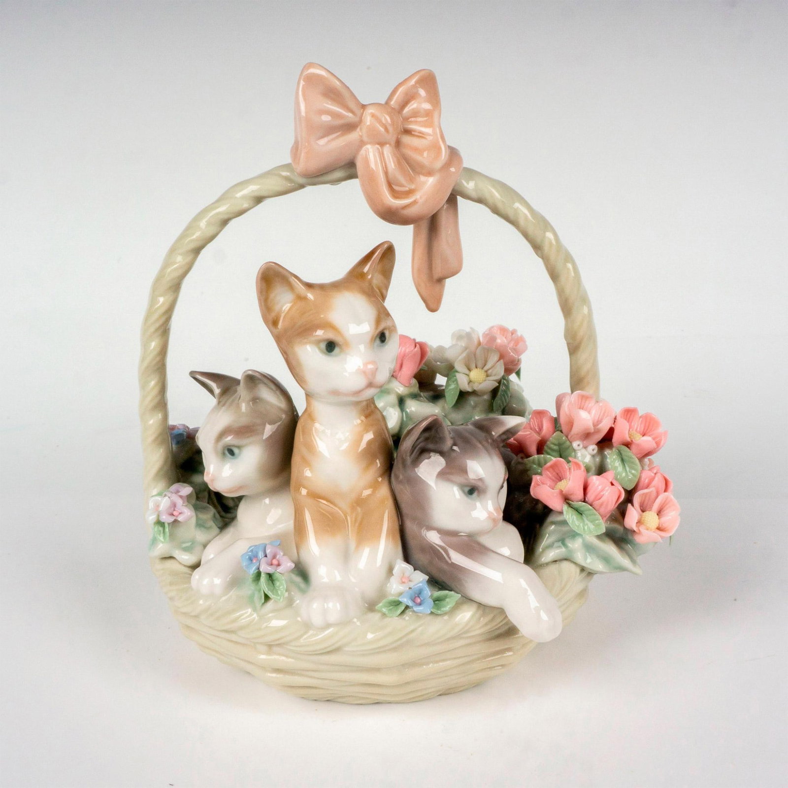 Purr-fect 1001444 - Lladro Porcelain Figurine: Glossy finish; Lladro backstamp. Artist: Juan Huerta Issued: 1983 - 2005 Dimensions: 5.5"H x 4.75"W Manufacturer: Lladro Country of Origin: Spain
