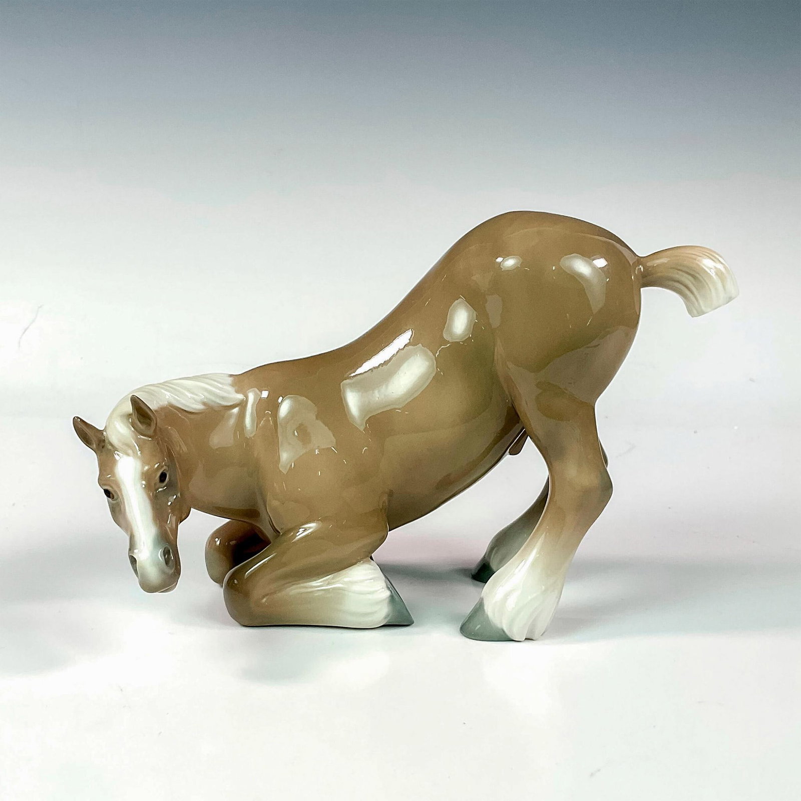 Percheron Horse 1004863 - Lladro Porcelain Figurine: Glossy finish; Lladro backstamp. Artist: Vicente Martinez Issued: 1974 - 1978 Dimensions: 5"H Manufacturer: Lladro Country of Origin: Spain