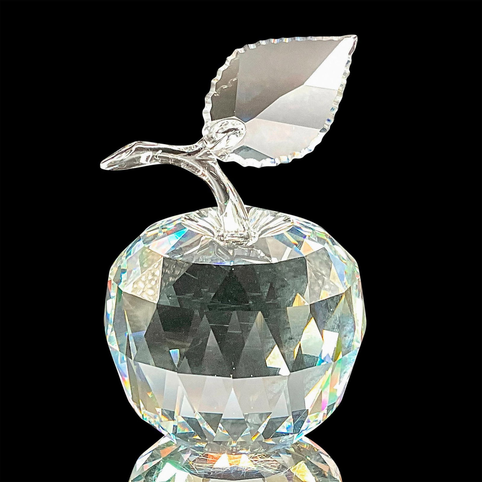 Swarovski Crystal Figurine, Apple: This Swarovski crystal apple was part of the Sparkling Fruit series. Made from clear crystal, the logo can be found on the bottom of the apple. Swarovski etched backstamp. Artist: Michael Stamey Issue