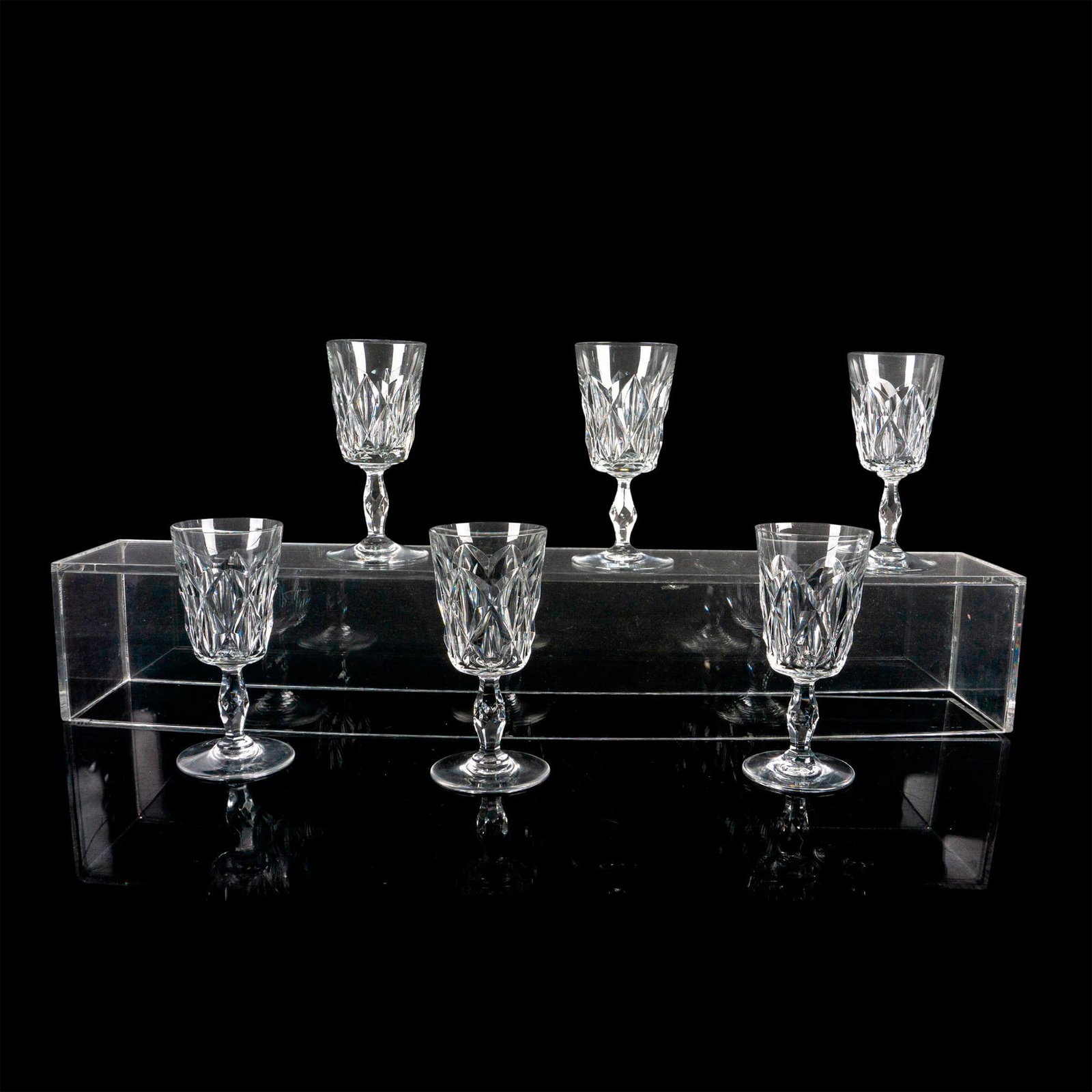 6pc Baccarat Claret Wine Glasses, Choiseul: Elegant crystal glasses with criss cross cut bowl and multi sided stem. Baccarat France etched backstamp. Dimensions: 2.5"W x 5.25"H Manufacturer: Baccarat Country of Origin: France
