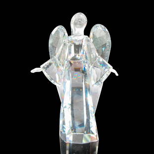 Swarovski Crystal Figurine, Angel Sophia: Beautiful, clear faceted body has frosted face and hands. Swarovski backstamp. This item has its original box: 7"L x 7"W x 4.5"H. Issued: 20th century Dimensions: 3"L x 1.75"W x 5.25"H Manufacturer: S