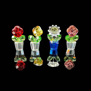 4pc Swarovski Crystal Figurines, Flowers in Pots: This Swarovski Crystal Moments flower grouping is delightful addition to the Happy Flowers category. This arrangement showcases crystal flower heads in clear, pink, yellow, and red hues, complemented