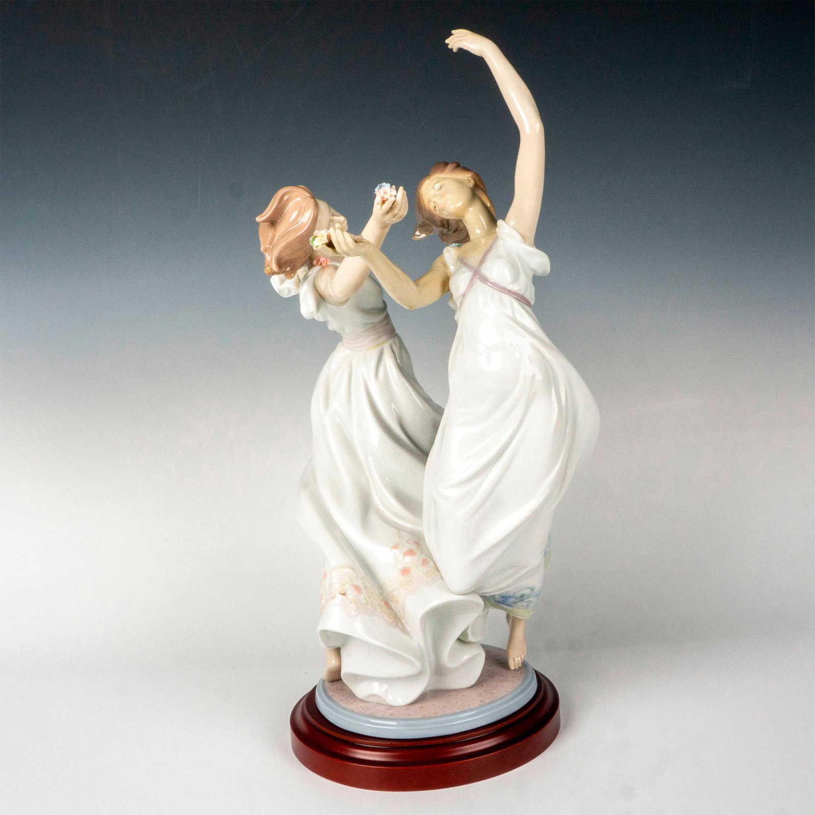 Dance of The Nymphs - Lladro Porcelain Figurine: Limited edition, glaze finish modeled as dancers dancing gracefully. Lladro backstamp. This item has its original box. Box measures: 25.5"L x 13.5"W x 14"H. Certificate of Authenticity included. This 