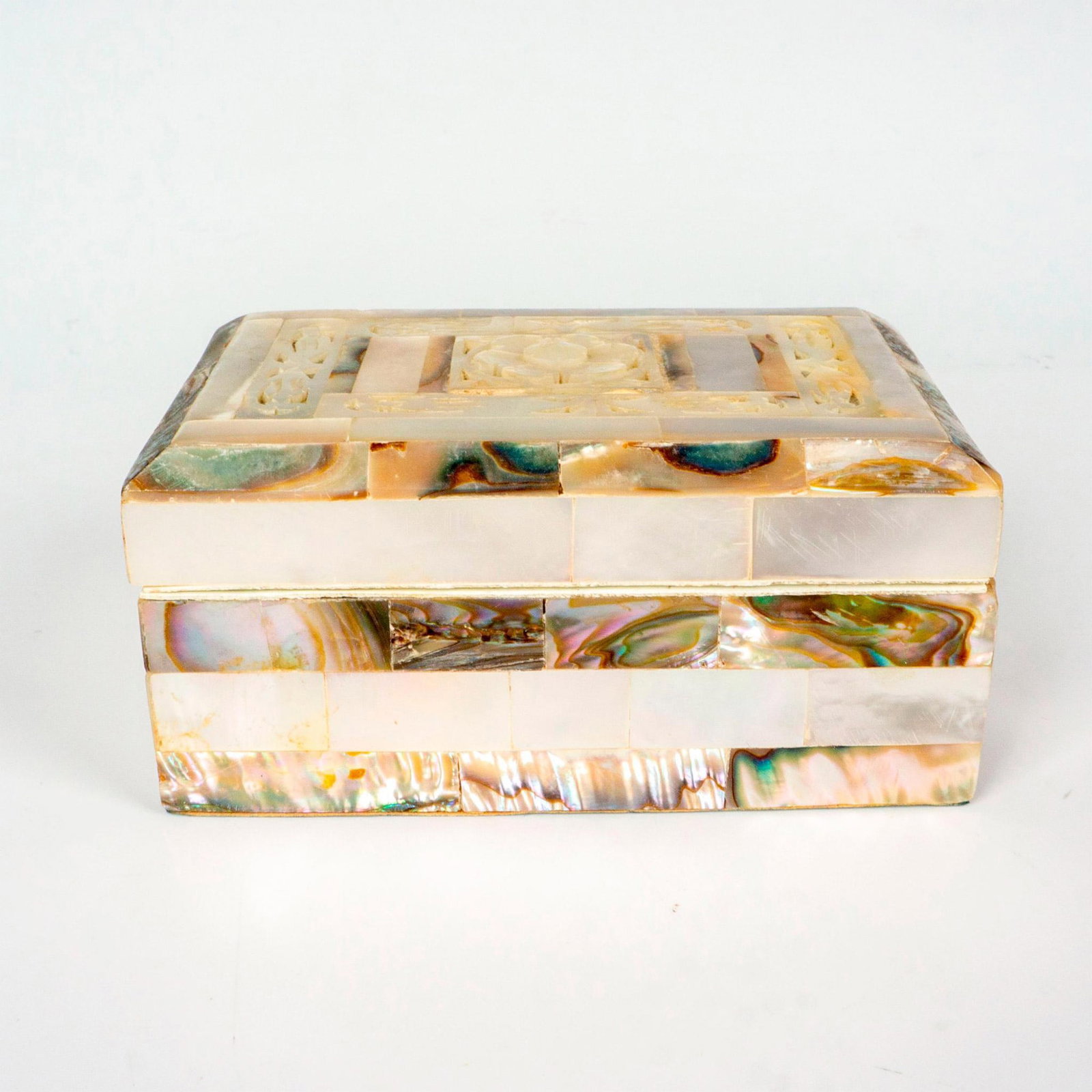 Vintage Mother of Pearl Lidded Box: A lovely small box, made from abalone and mother of pearl exterior, red velvet lined interior. Dimensions: 3.5"L x 2.5"W x 1.5"H