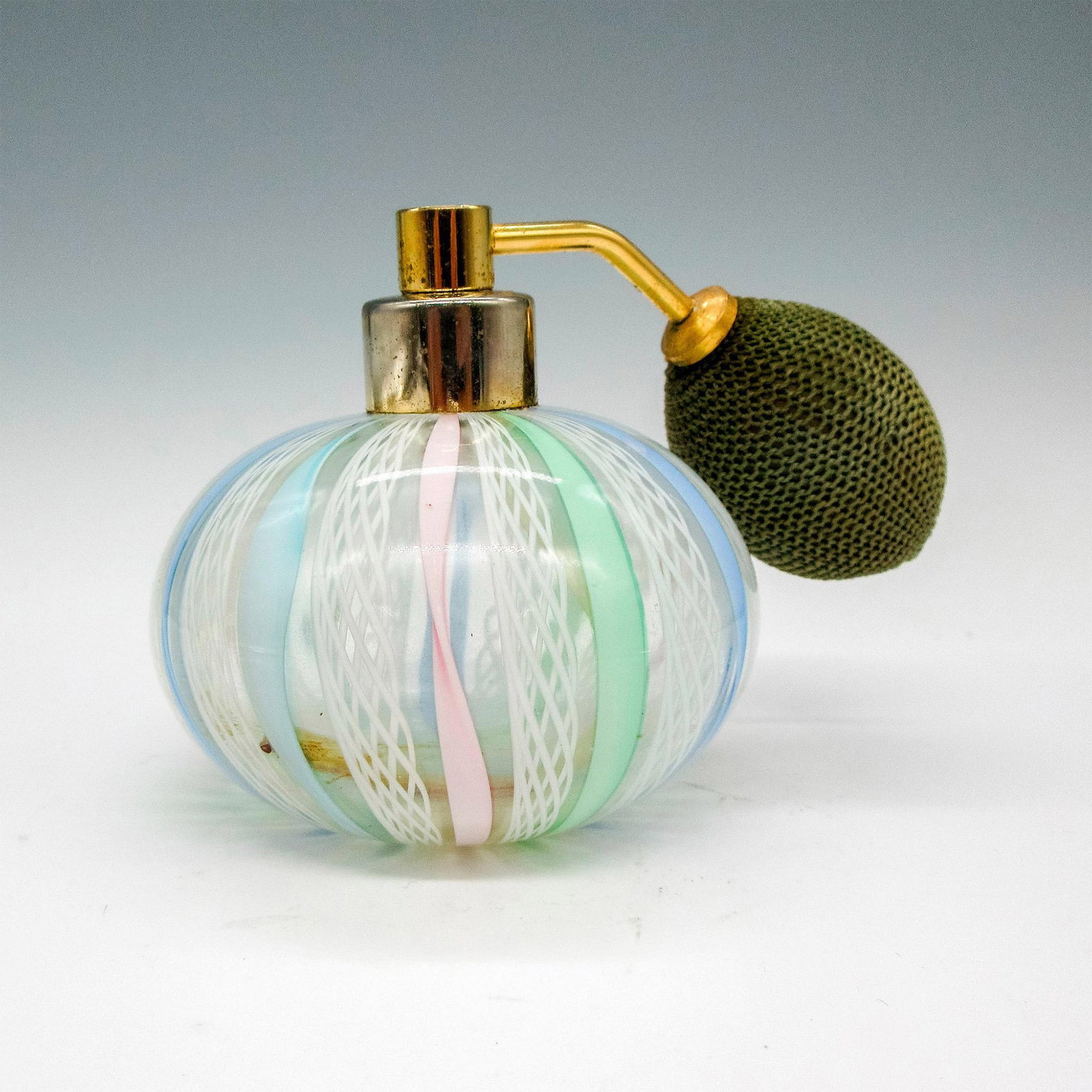 Murano Art Glass Perfume Atomizer: Venetian white lace pattern in pastel colors of pink, blue and sage. Issued: 20th century Dimensions: 3.25"H x 3"dia. Manufacturer: Murano Glass Country of Origin: Italy
