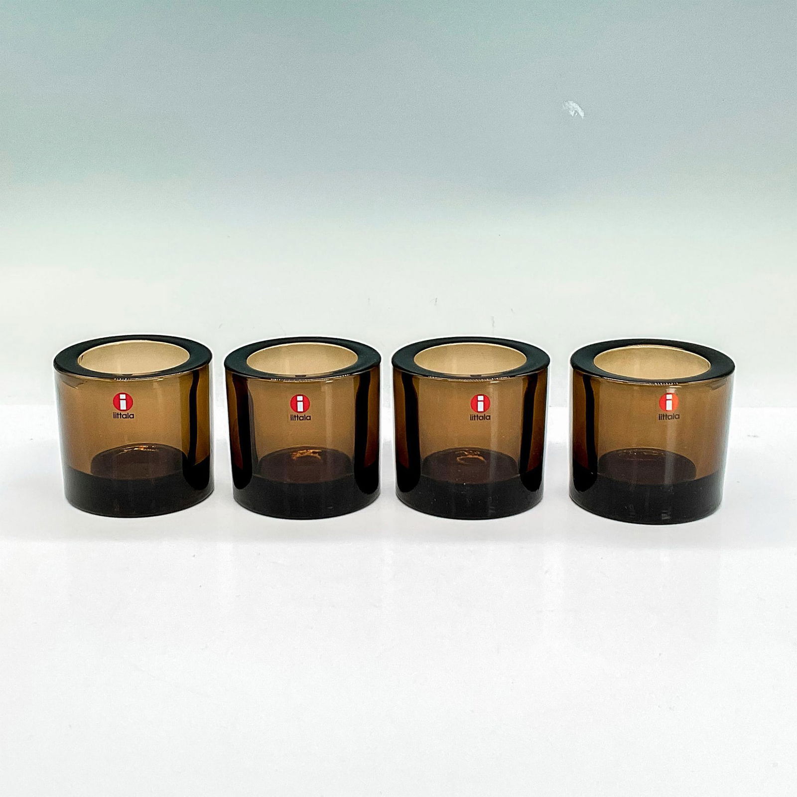 4pc Iittala Marimekko Glass Votive Holders, Kivi, Brown: Thick coffee brown votive holders. Marimekko embossed mark to bottom. Dimensions: 2.25"H x 2.5"dia Manufacturer: Iittala Country of Origin: Finland