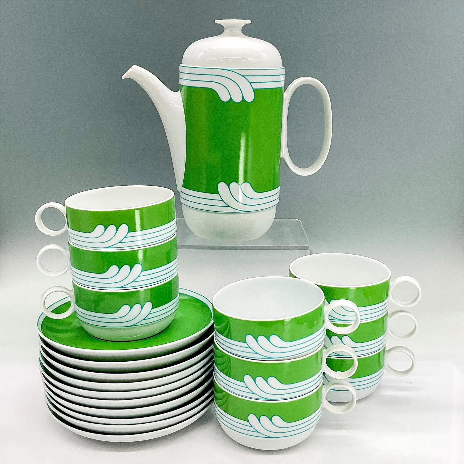 20pc Rosenthal Studio-Linie Tea Set, Duo Exotic Green: Tea set in white porcelain with a fun kelly green and bright blue pattern. Rosenthal backstamp. Tea pot 8"L x 4"W x 8.5"H. Cups 4.5"L x 3.5"W x 2"H. Saucers 0.75"H x 6"dia. Designed by Ambrogio Pozzi
