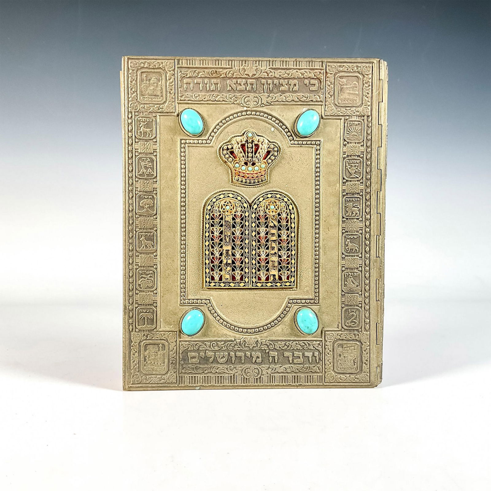 The Haggadah, Book by Arthur Szyk: Jerusalem: Massadah and Alumoth. A stunning brass-plated cover adored with embossed Judaic symbols on the front, and four turquoise-colored stones on the back. English translation and stunning illustr