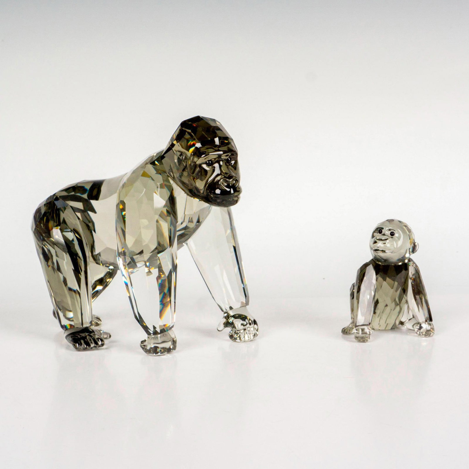 Swarovski Crystal Society Figurine, Gorillas: Part of the 2008-2010 Endangered Wildlife Trilogy. Depicts a mother and an infant gorillas in Black Diamond crystal. Swarovski markings. Certificate of Authenticity included. This item has its origina