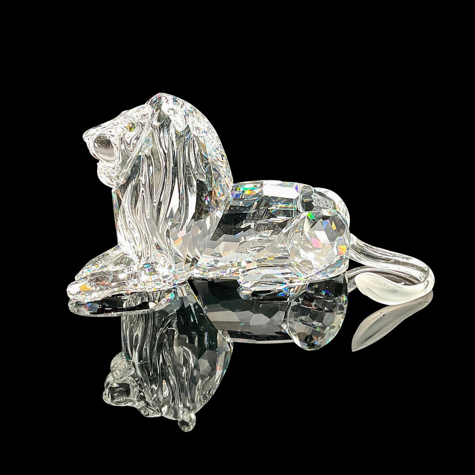 Swarovski SCS Crystal Figurine Lion: The third edition of the Inspiration Africa trilogy, available only to SCS members. The Lion features a faceted clear crystal body with just a bit of frosting at the end of the tail. Swarovski etched 