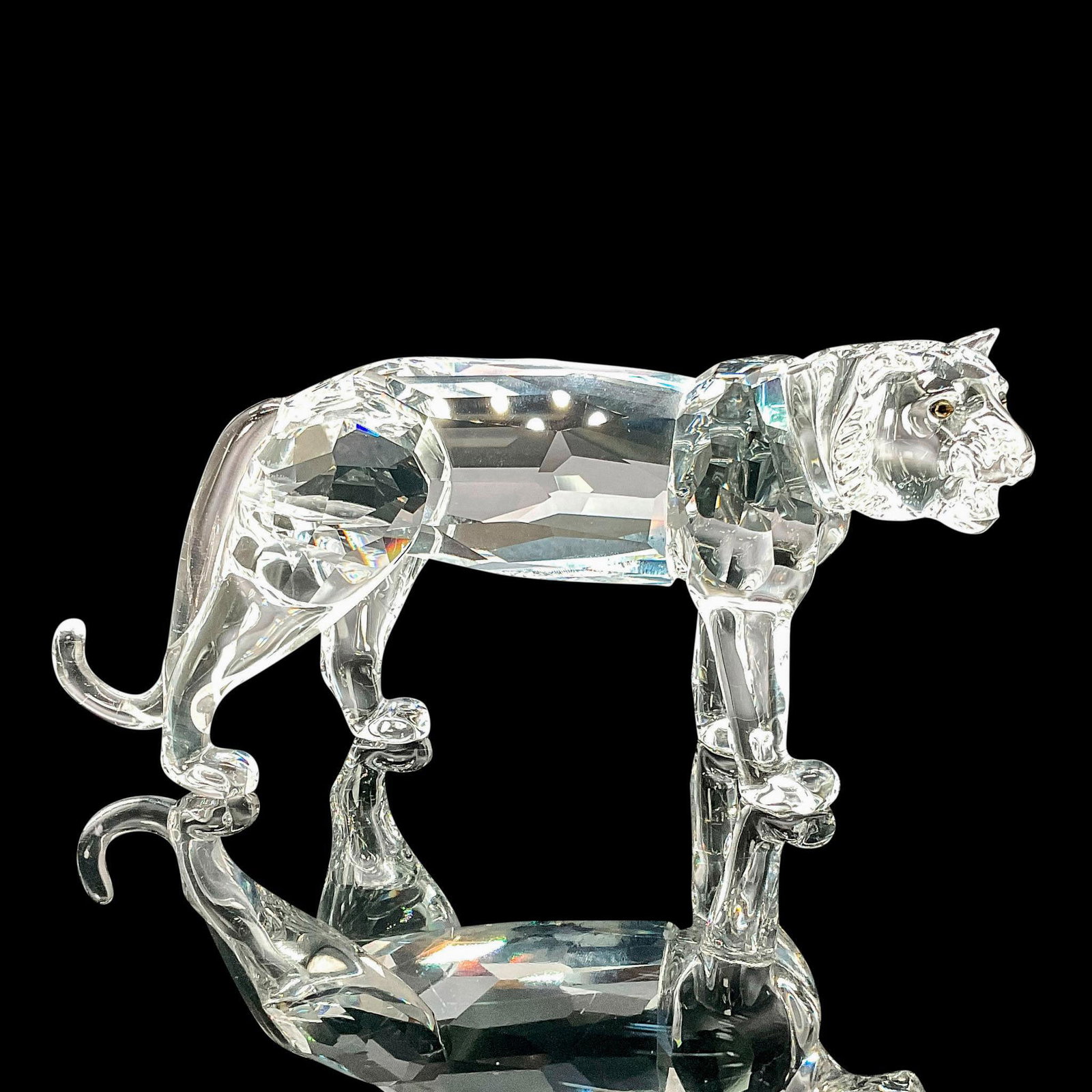 Swarovski Crystal Figurine Tiger: This Swarovski crystal tiger was a member of the Endangered Species collection and is made from clear crystal with jet black eyes. This item has its original box which measures 8"L x 7.5"W x 3.5"H. Sw