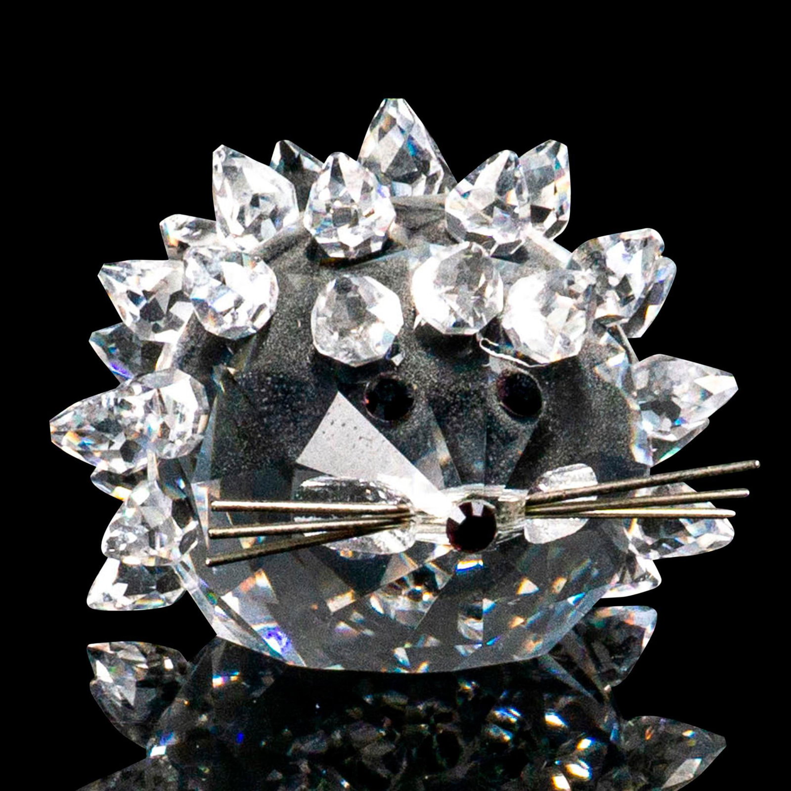 Swarovski Silver Crystal Figurine, Mini Hedgehog: Lead crystal hedgehog for the USA/Canadian market only. It is made with jet crystal eyes and nose and silver-tone metal whiskers. Swarovski etched backstamp. Artist: Max Schreck Issued: 1982-1987 Dime