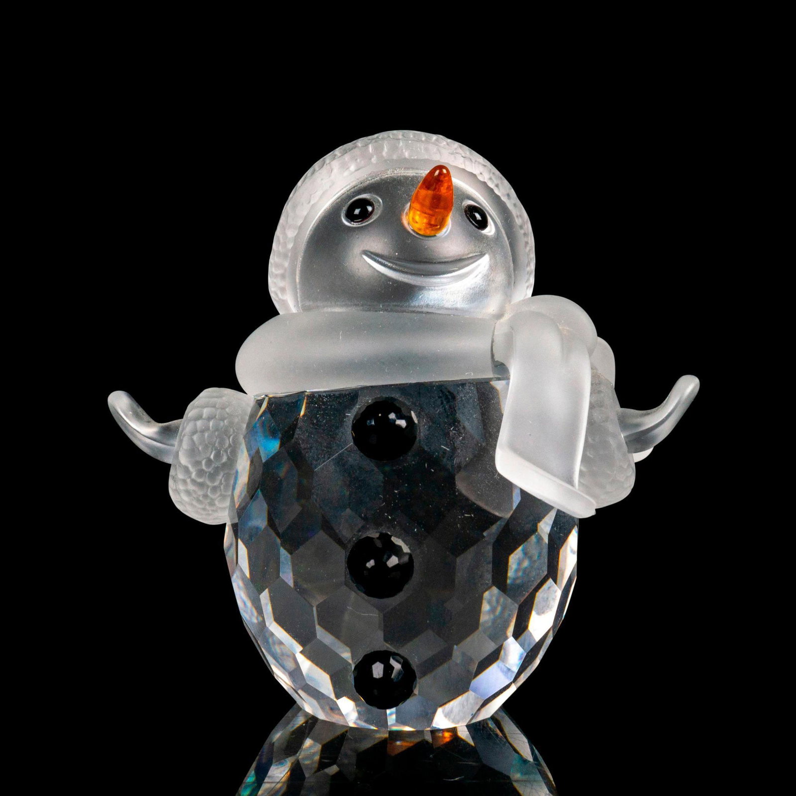 Swarovski Crystal Figurine, Snowman: Lead crystal part of the Cheerful Times collection and is made with frosted crystal face, arms, and scarf. Swarovski etched backstamp. Artist: Edith Mair Issued: 2000-2009 Dimensions: 1"L x 1.5"W x 2.