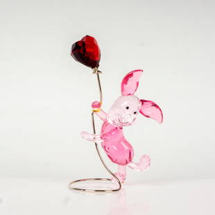 Swarovski Disney Crystal Figurine, Winnie The Pooh Piglet: Rosaline and rose crystal piglet holding a heart-shaped Light Siam Satin crystal balloon on a silver-tone metal wire. Swarovski etched backstamp. Artist: Designer Team Issued: 2012-2016 Dimensions: 1.